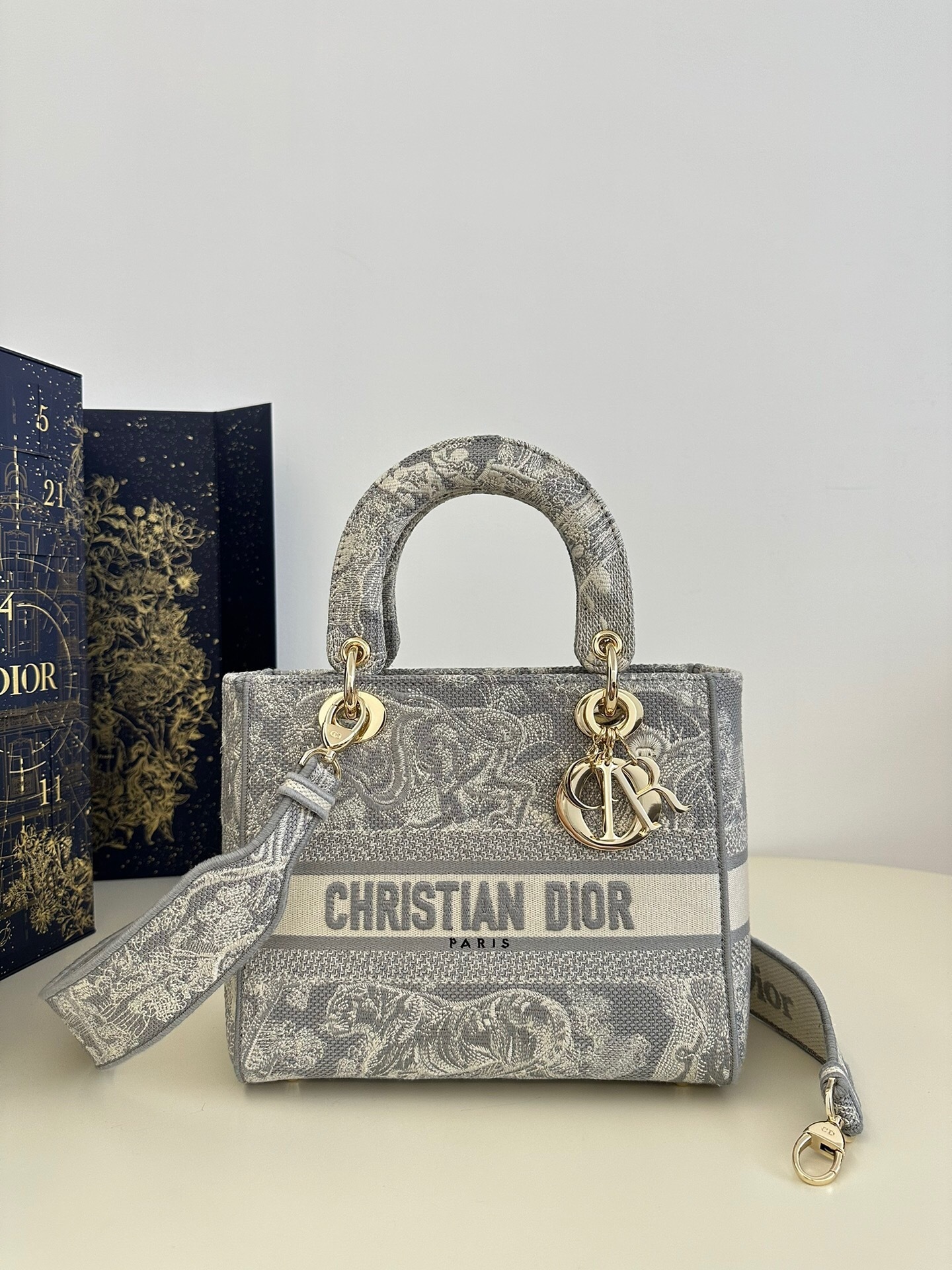 Christian Dior Medium Lady D-Lite bag with Toile de Jouy embroidery.