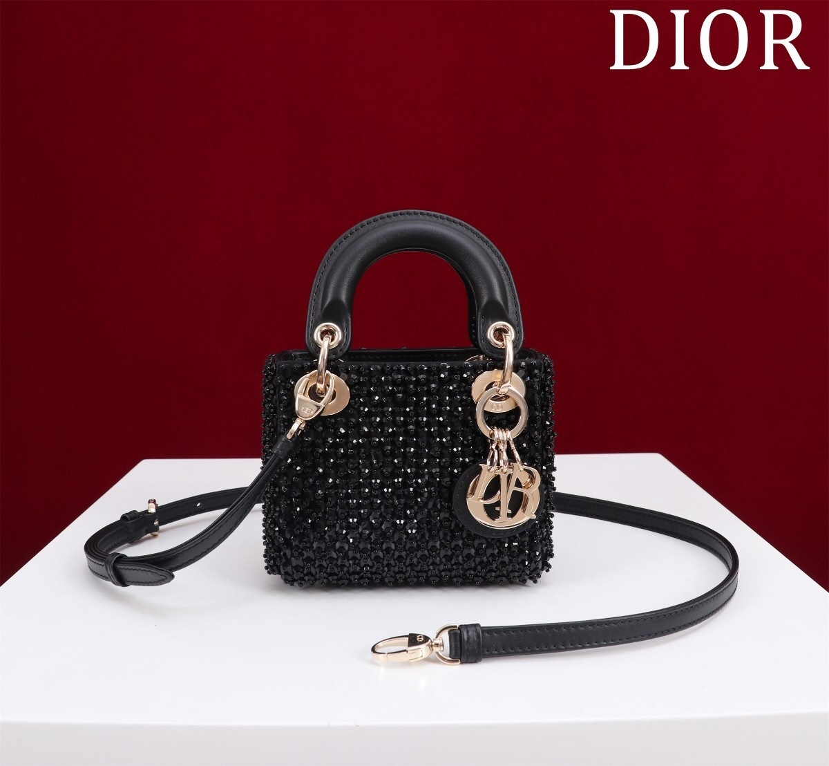 Christian Dior Lady Dior Micro Bag in black microbead-embroidered cotton with a Cannage motif.