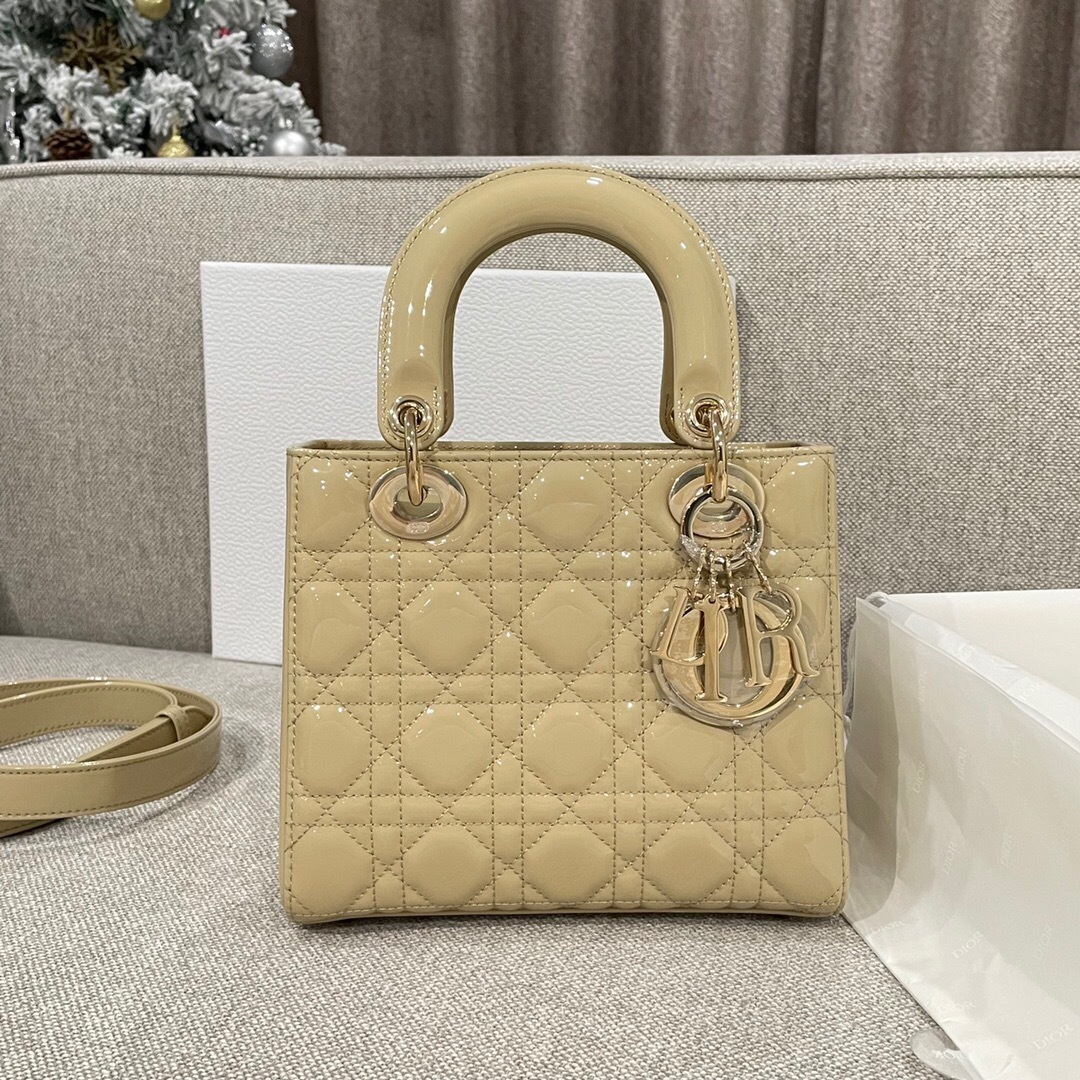Christian Dior Lady Dior medium bag in beige patent leather with Cannage stitching.