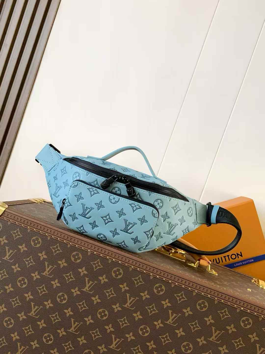 LV Rush Bumbag in a light blue color with the brand's monogram pattern