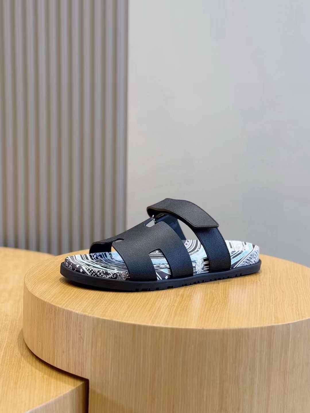 Hermes Chypre sandals in black and blue