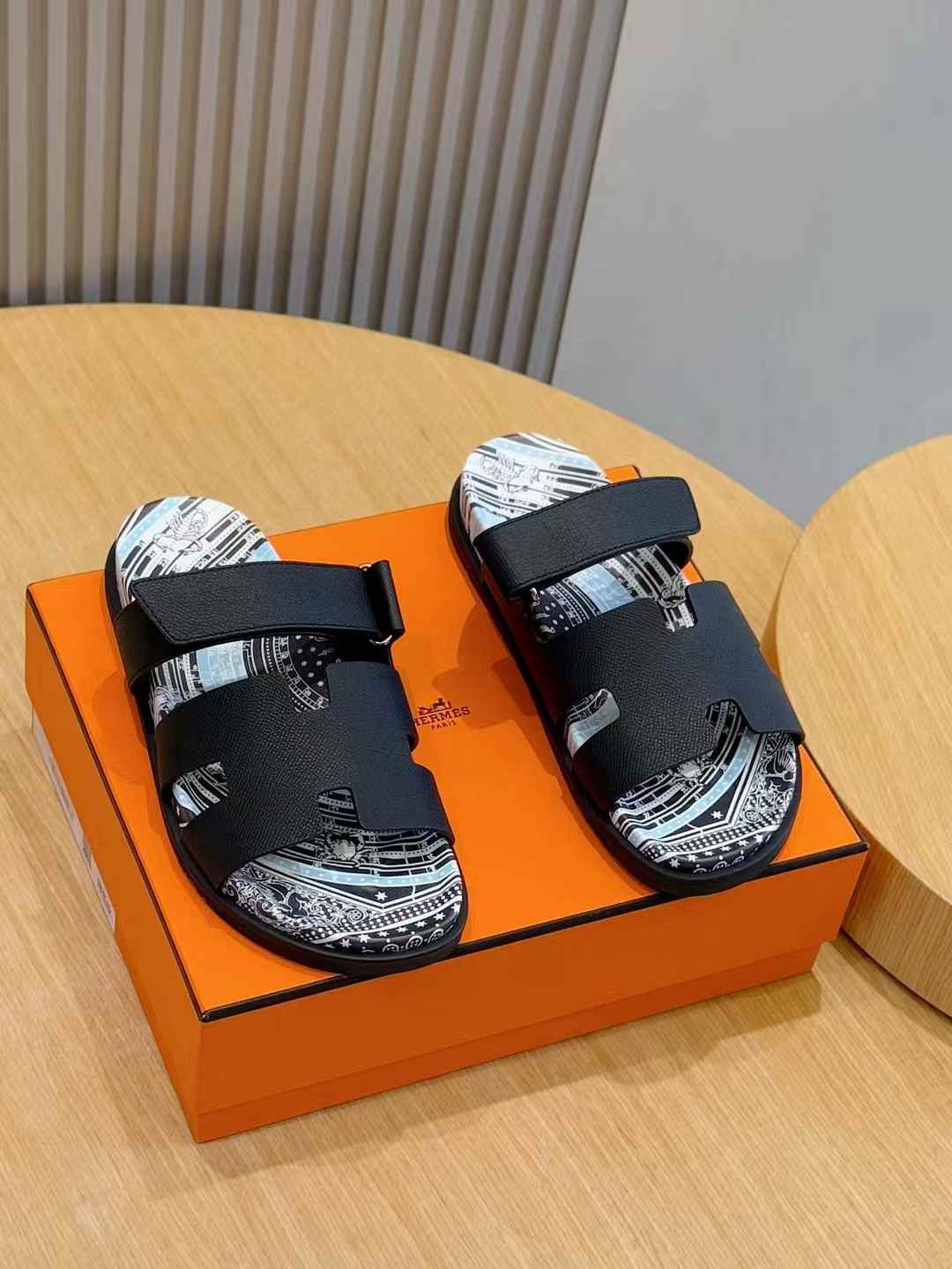 Hermes Chypre sandals in black and blue