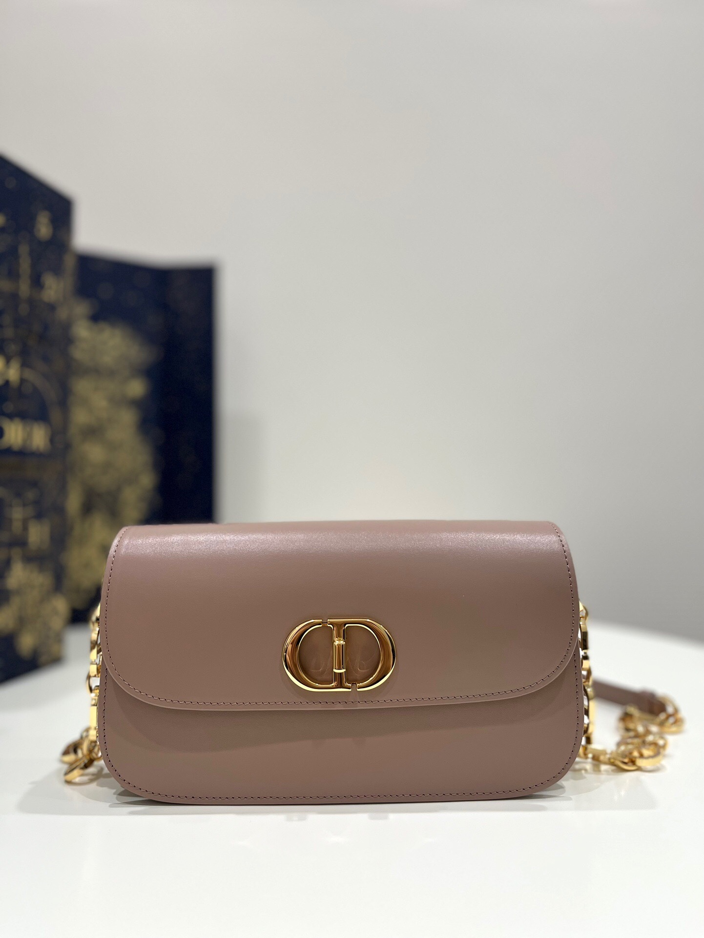 Dior 30 Montaigne Avenue bag in antique pink box calfskin with an antique gold-finish metal CD twist clasp.