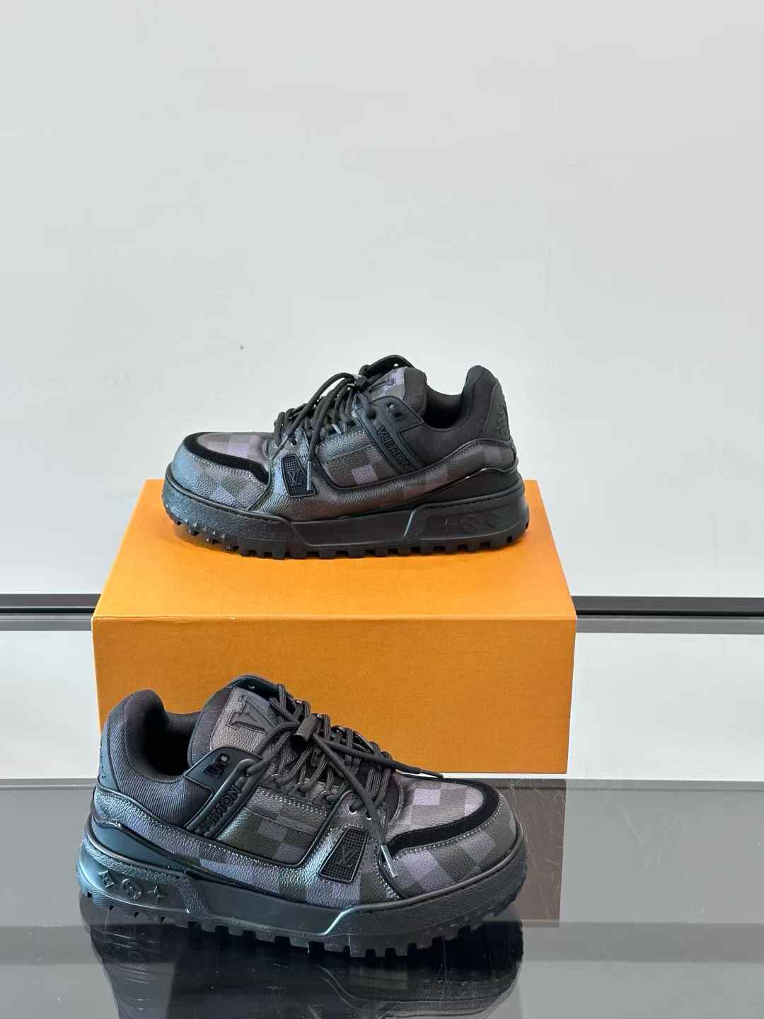 LV Trainer Maxi sneaker in black with a Damoflage pattern