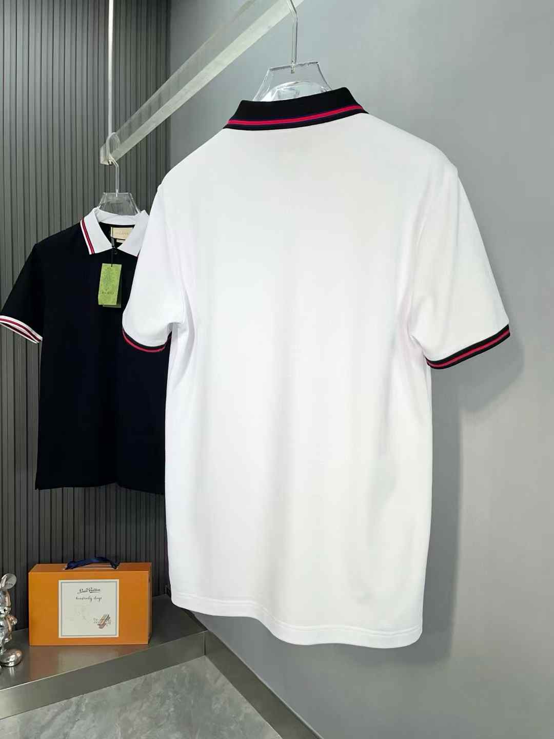 Gucci polo shirt with a red and black striped collar and sleeve cuffs