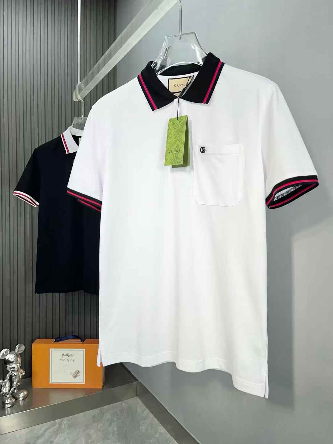 Gucci polo shirt with a red and black striped collar and sleeve cuffs