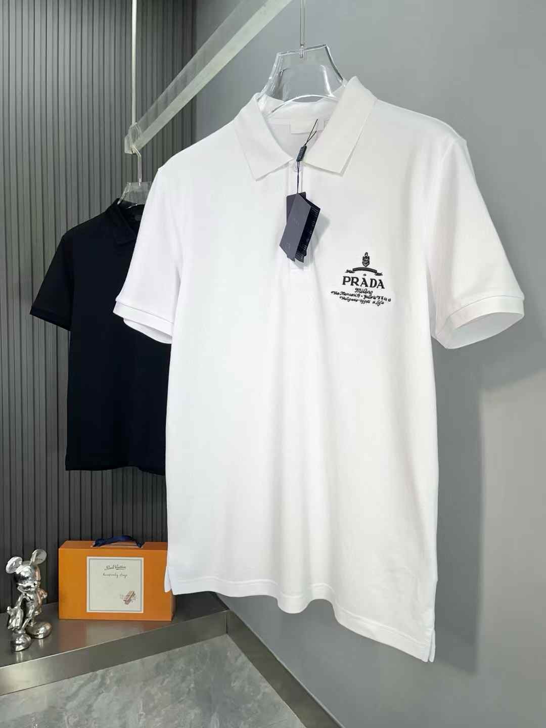 Prada white polo shirt with a logo on the chest