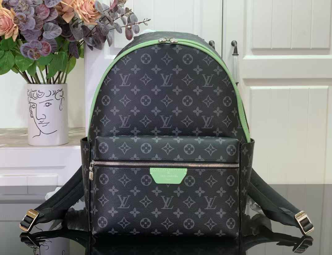 LV Discovery Backpack in black with a green trim