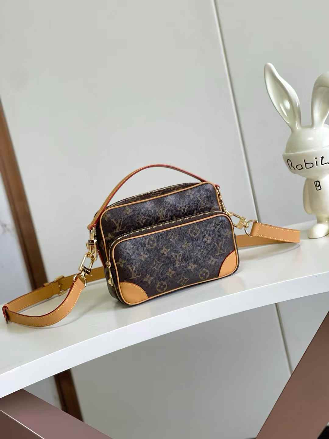 LV Nile shoulder bag in the signature Monogram pattern with Vachetta leather trim