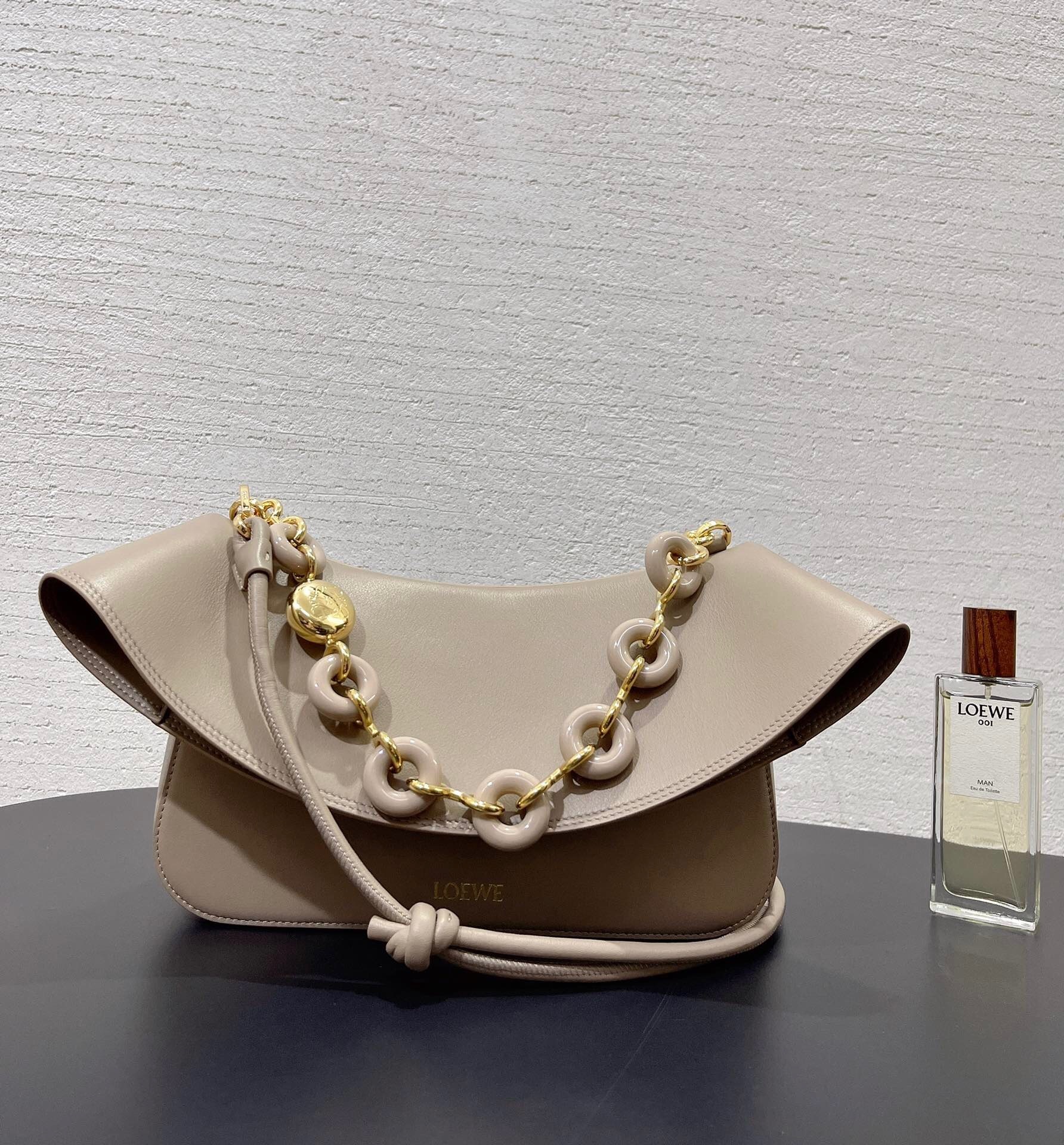 Loewe medium Ola chain-embellished flap shoulder bag in beige leather