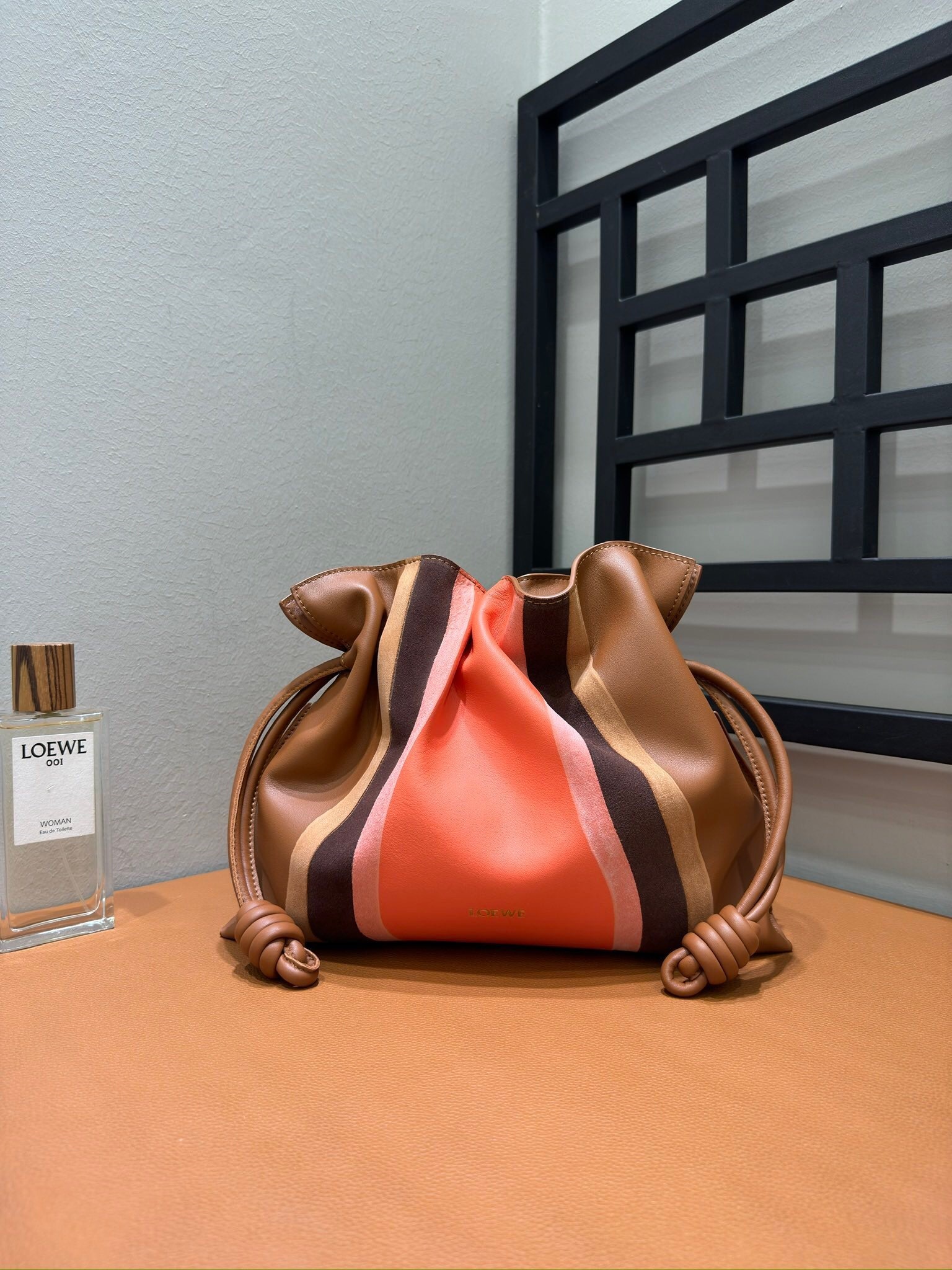 Loewe Flamenco clutch bag in a striped design