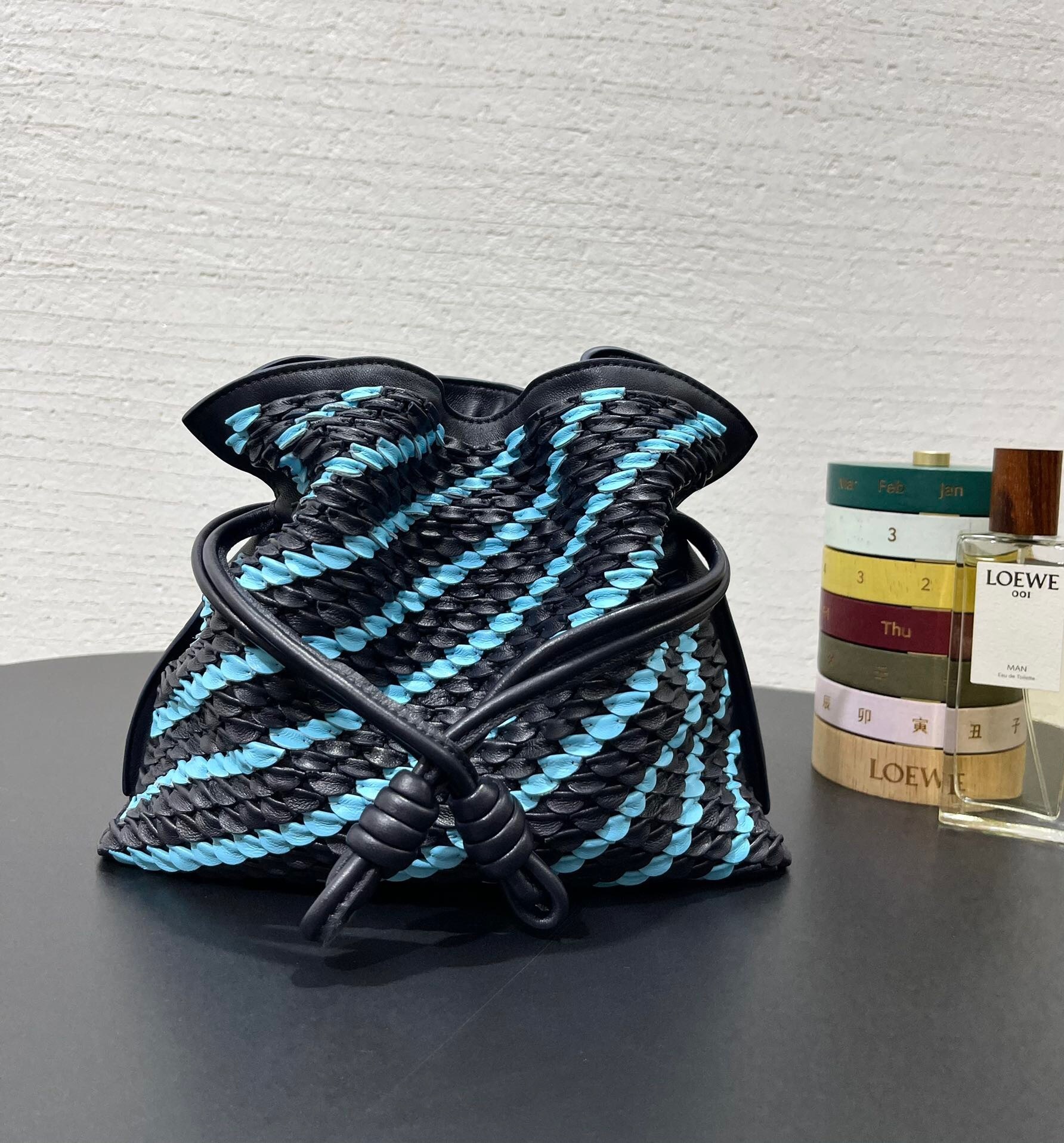 Loewe Flamenco Mini Scales Clutch Bag in black and blue woven leather
