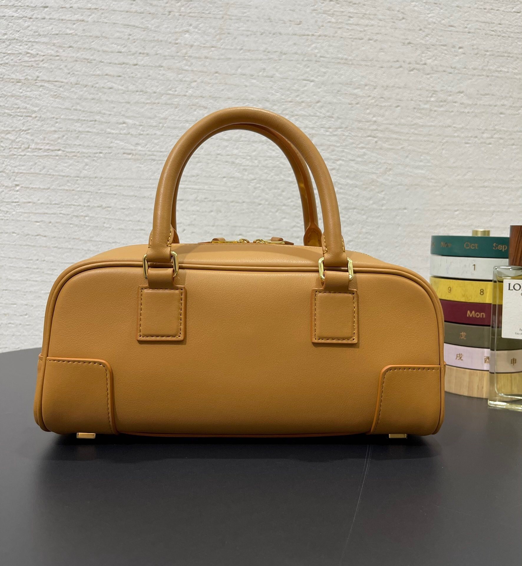 Loewe Amazona 23 cropped Top handle bag in nappa calfskin in a warm desert or dark brownie color with gold-finish hardware