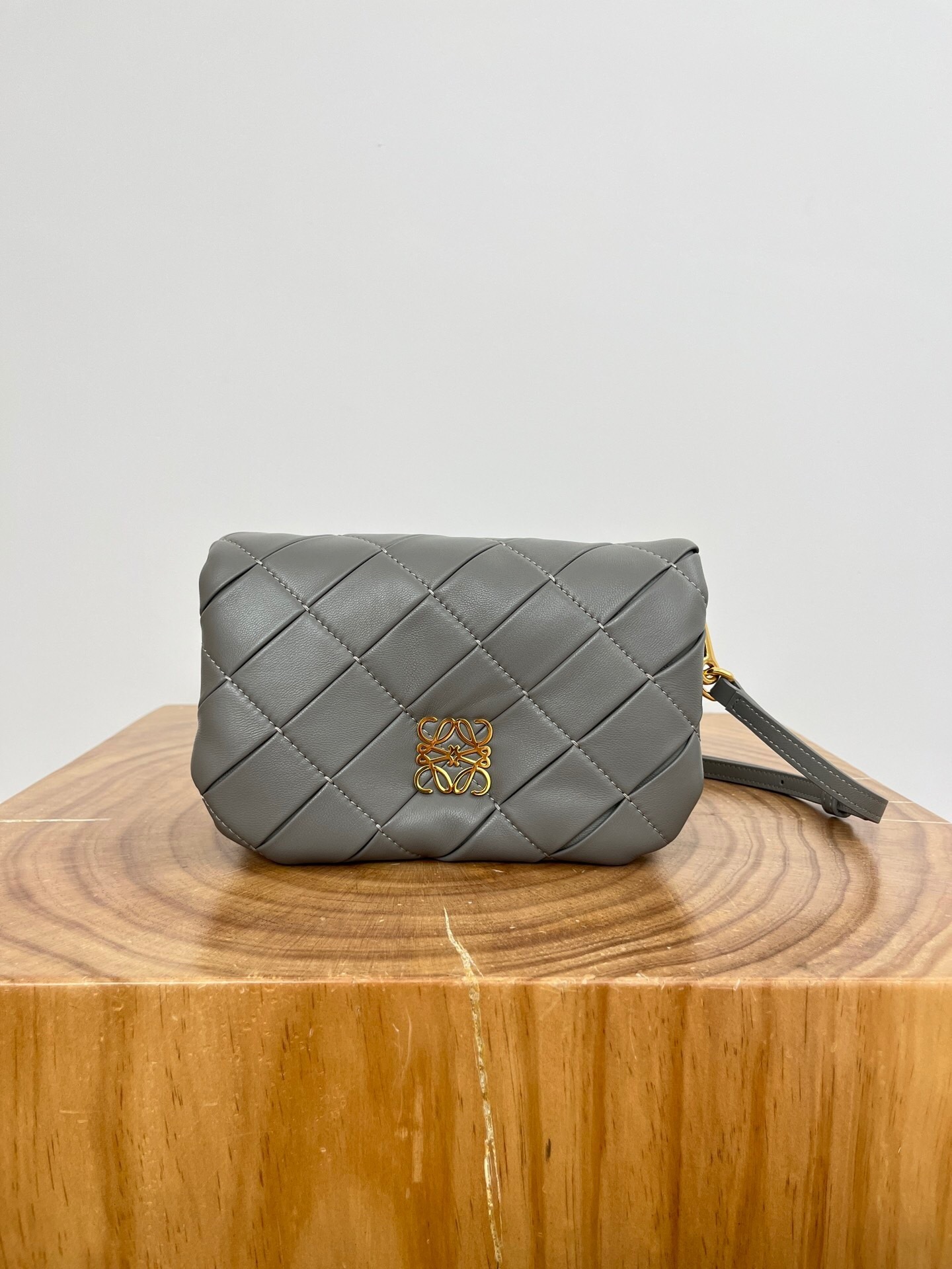 Loewe Goya Puffer mini bag in pleated gray leather with gold-tone Anagram logo hardware