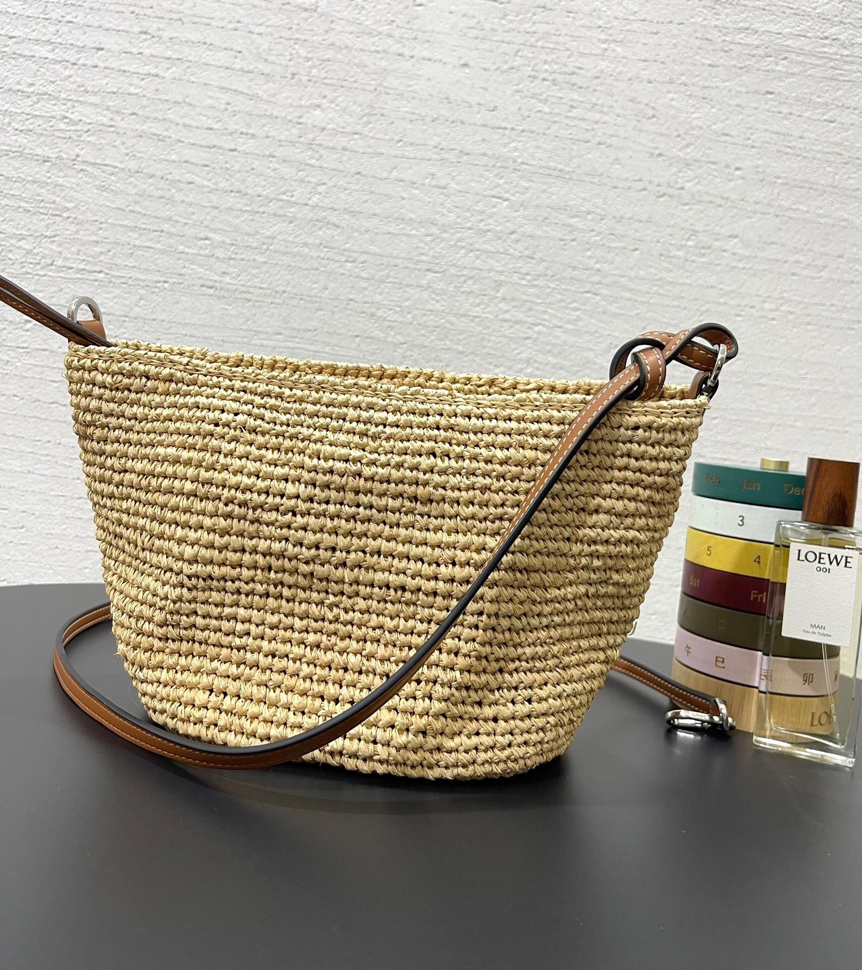 Loewe x Paula's Ibiza Slit Pochette bag in natural raffia and tan calfskin leather