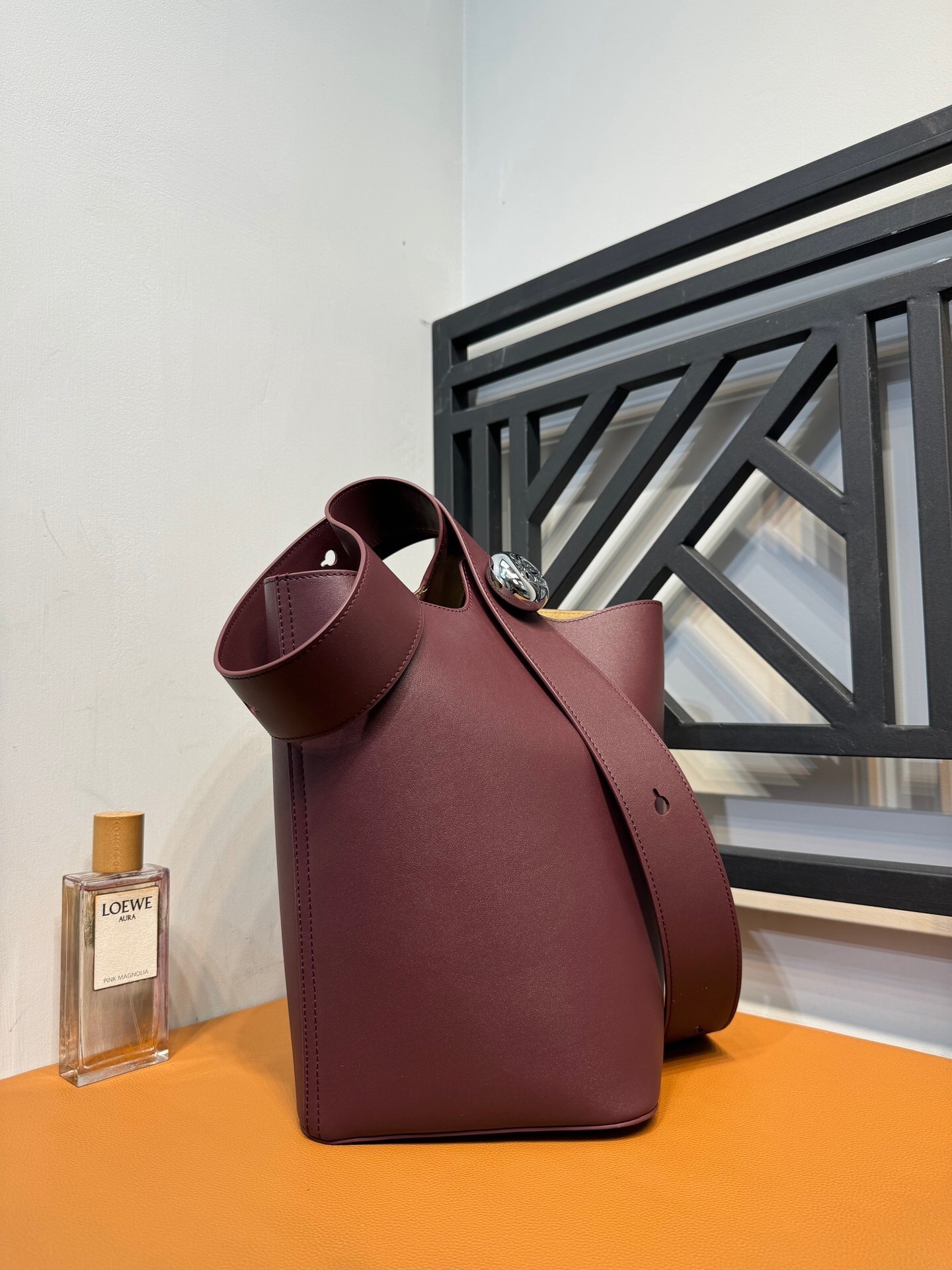 Loewe Pebble bucket bag in a burgundy or plum calf leather