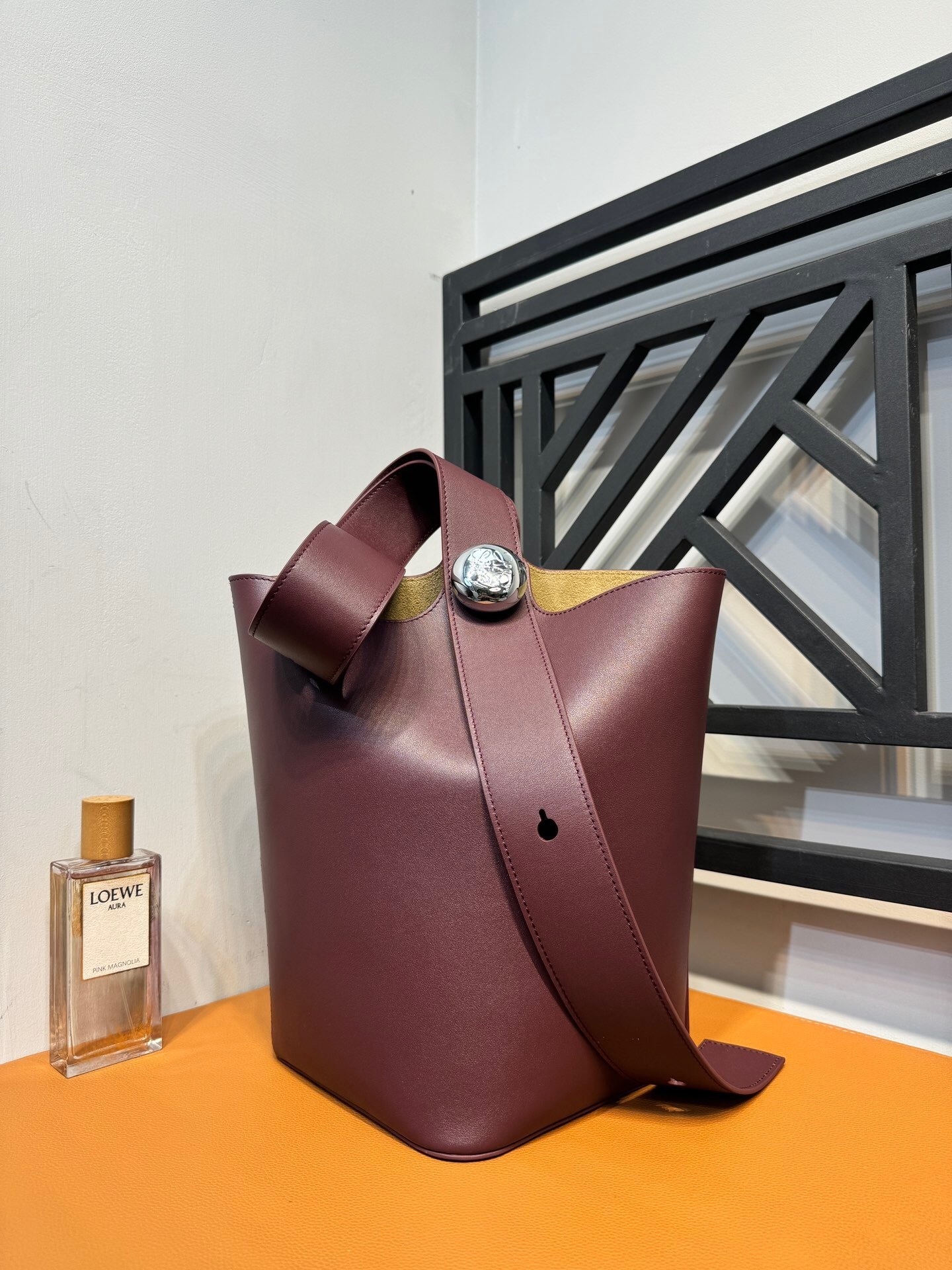 Loewe Pebble bucket bag in a burgundy or plum calf leather