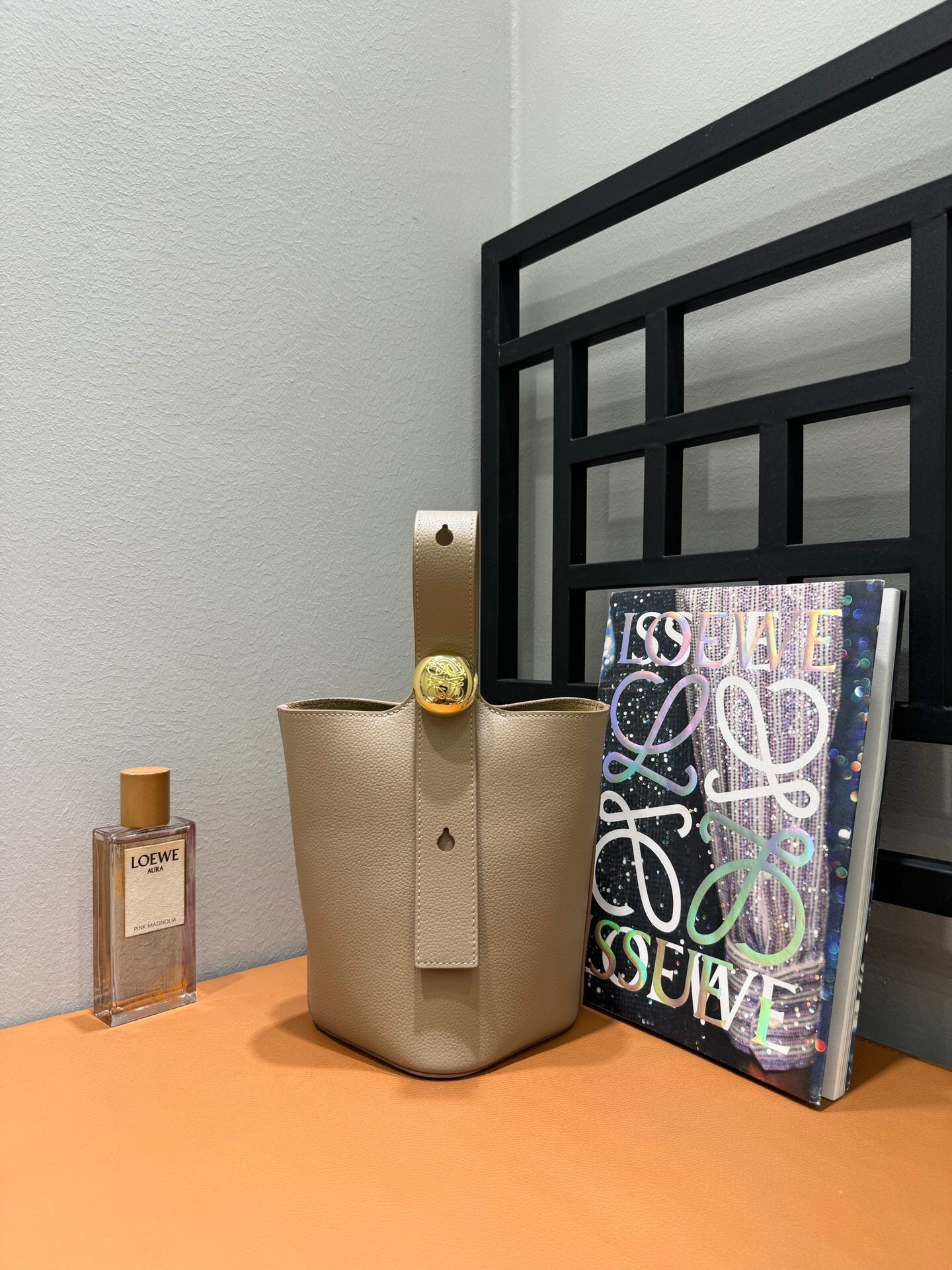 Loewe Mini Pebble bucket bag in beige or ochre brown calf leather