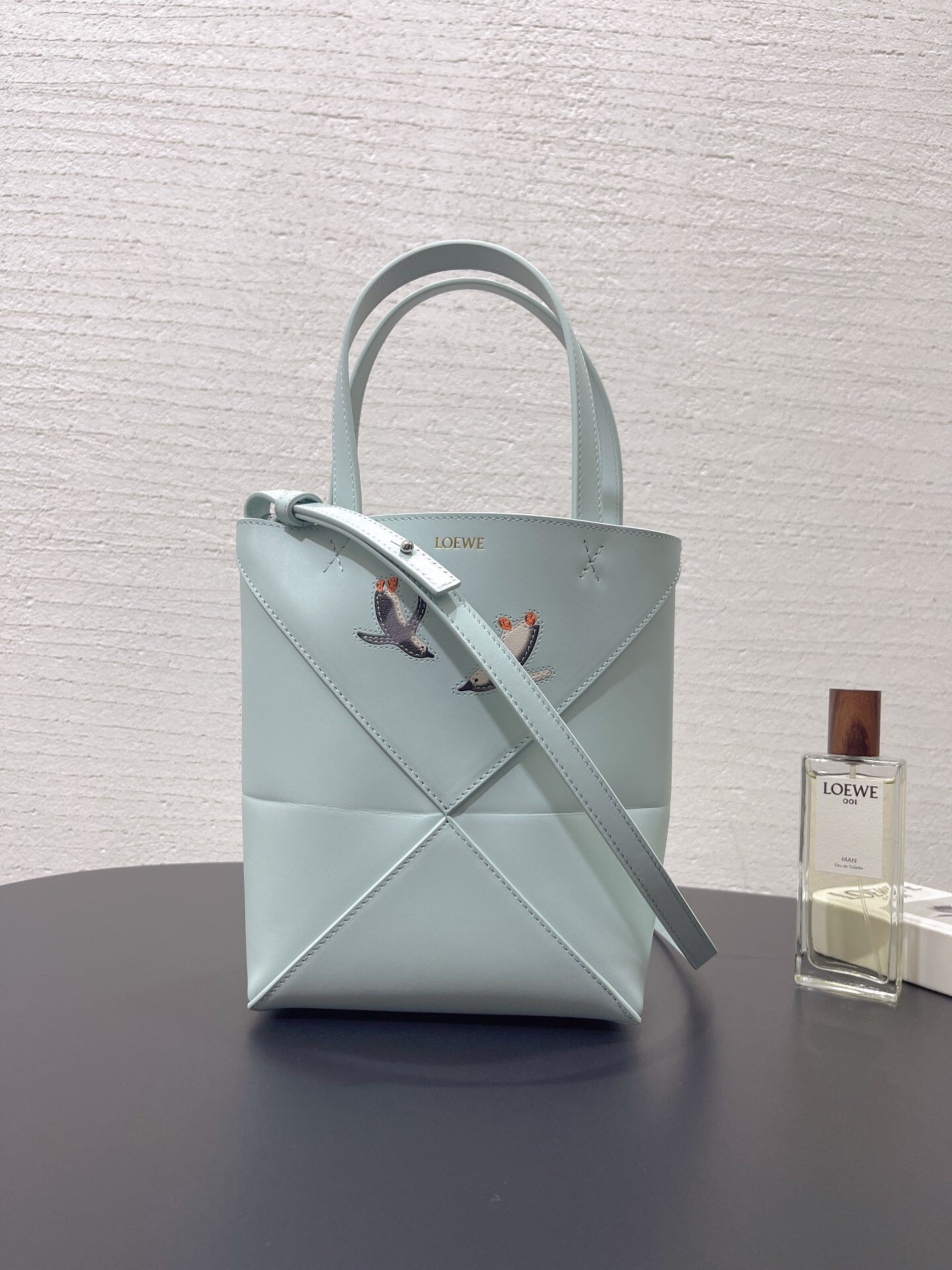 Loewe x Suna Fujita Mini Puzzle Fold Tote bag in blue iceberg shiny calfskin leather