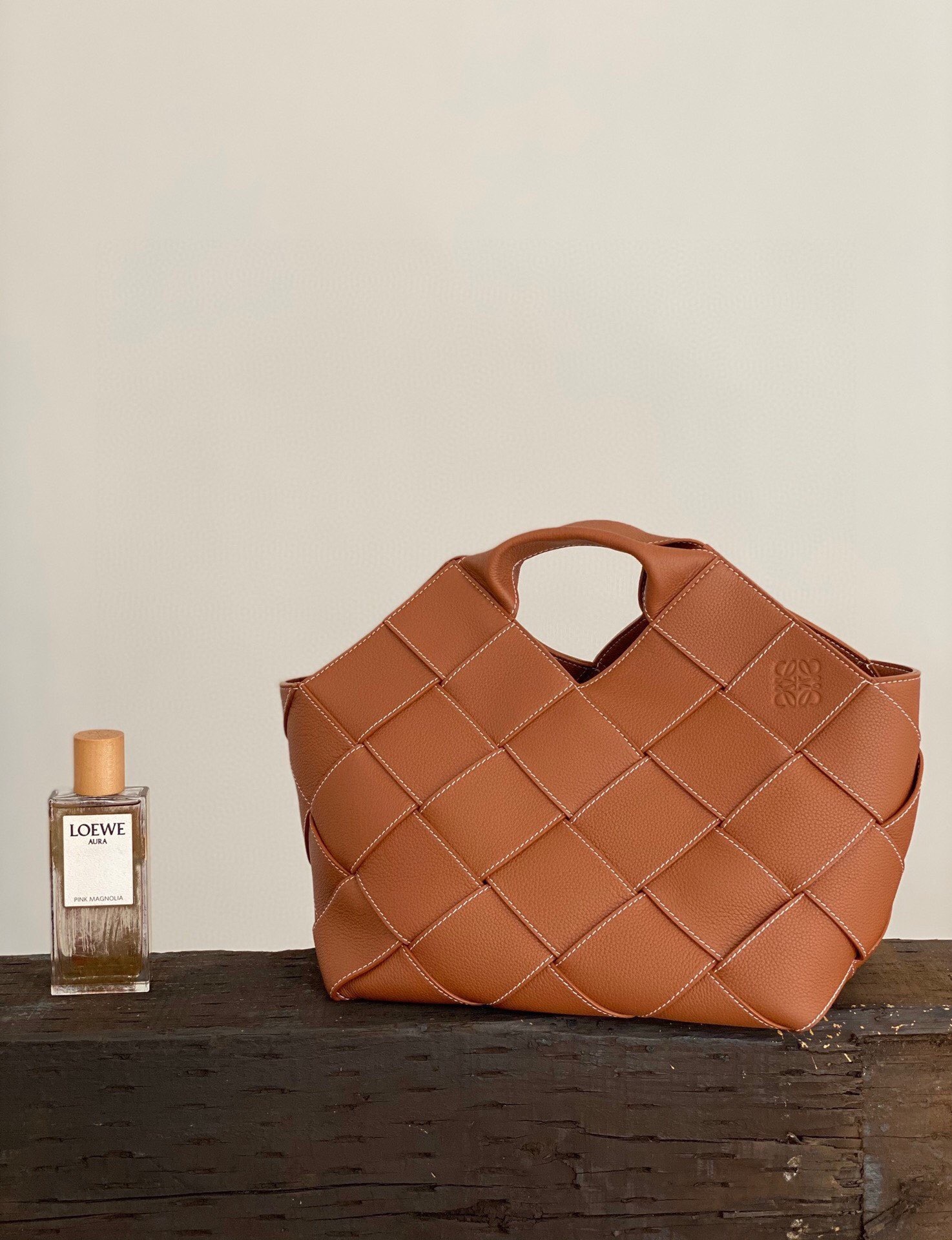 Loewe Small Surplus Leather Woven basket bag in a brown calfskin