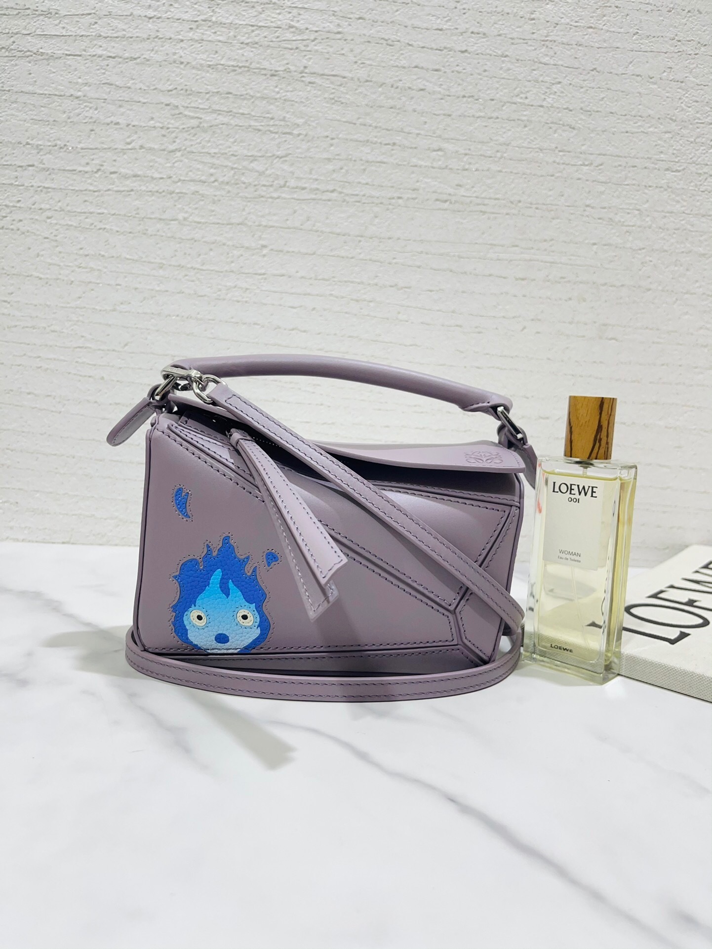 Loewe x Howl's Moving Castle Puzzle Calcifer small leather shoulder bag in a light purple/blue-grey color