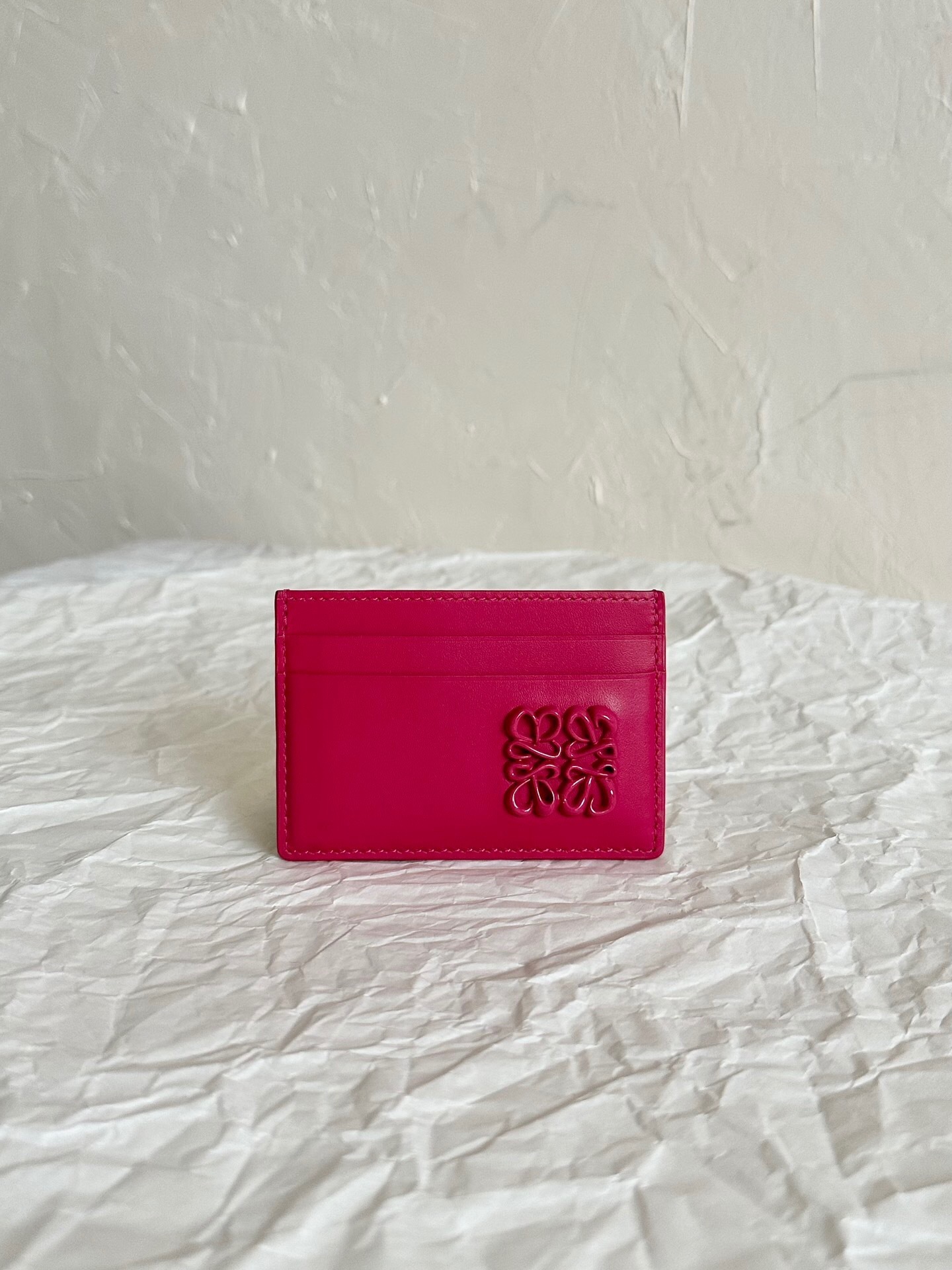 Loewe Anagram card case in a bright pink or fuchsia leather