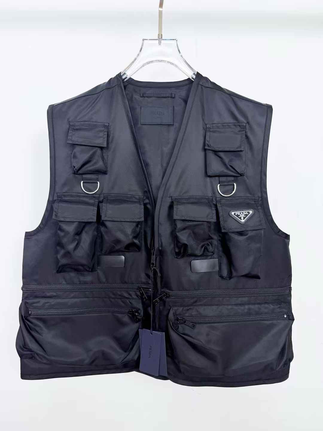 Prada Re-Nylon Black Vest V-neck, front zip fastening, and the iconic enameled metal triangle logo on the ches