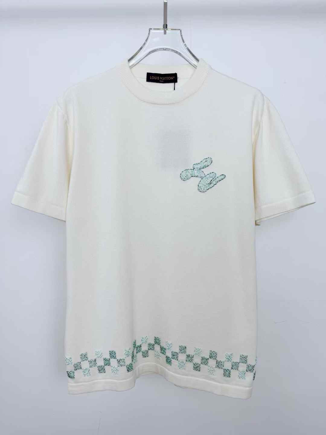 LV Embellished Short-Sleeved Crewneck in milky white organic cotton with a beaded Damier motif on the bottom hem and a beaded cursive LV on the chest