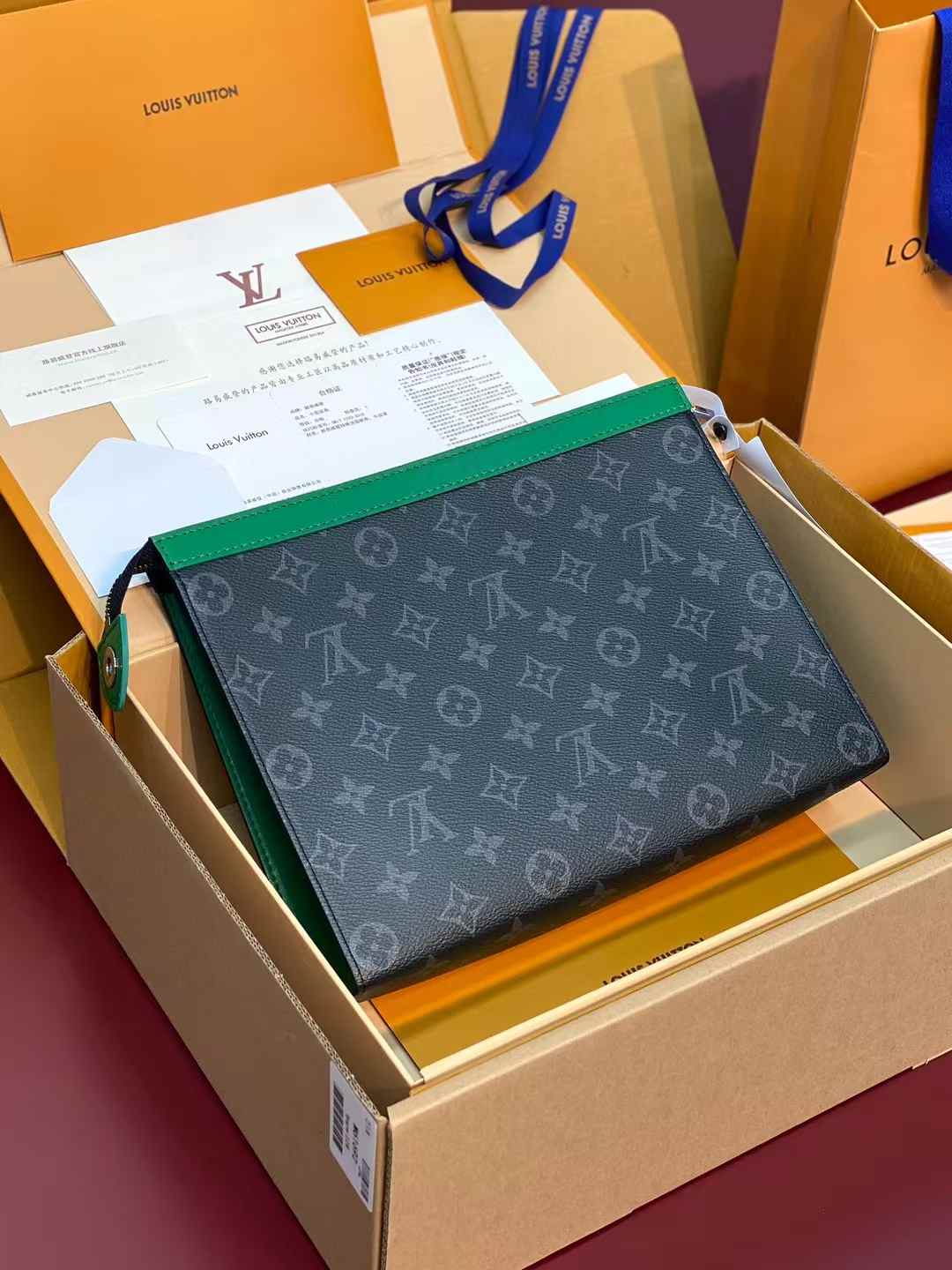 LV Pochette Voyage MM in Monogram Eclipse coated canvas with green trim
