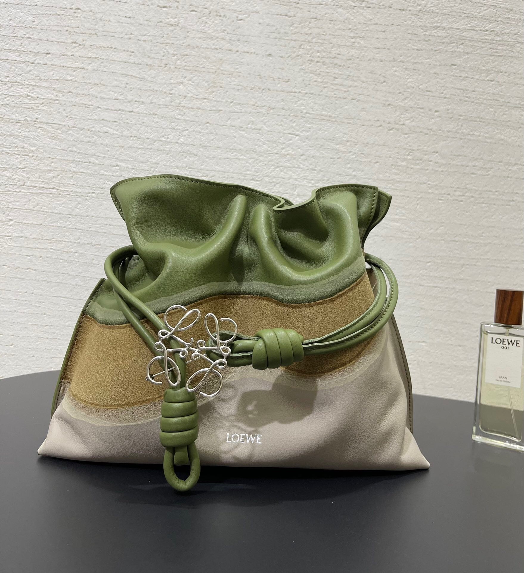 Loewe Flamenco clutch bag, crafted from soft nappa calfskin with a cinched closure and knot drawstrings