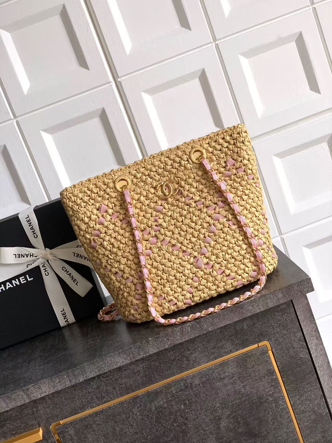 Chanel straw tote bag with a pink woven pattern