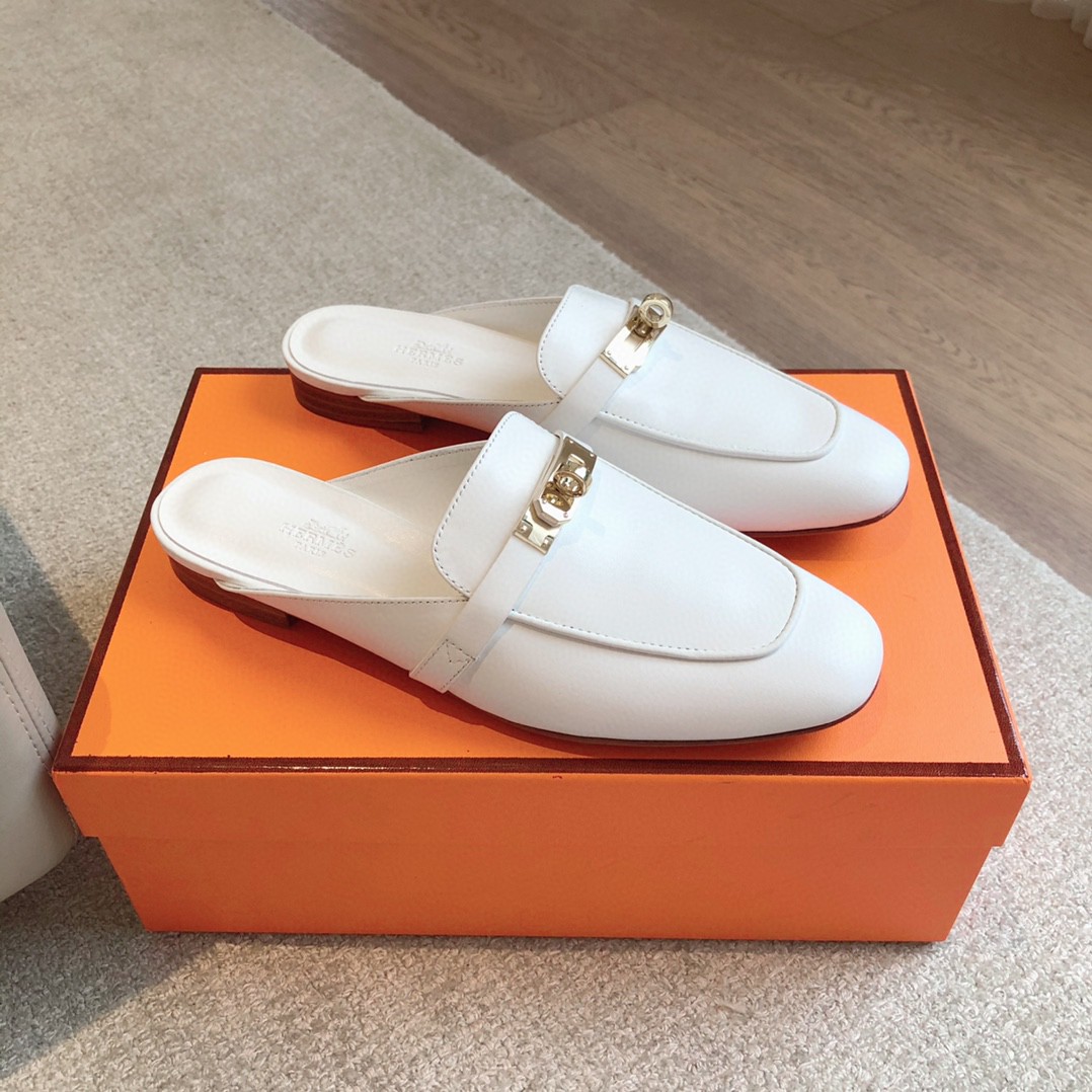 Hermès Oz mules in white calfskin leather with a rose gold-plated Kelly buckle