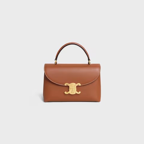 Celine Teen Nino bag in supple grained calfskin, featuring the brand's Triomphe metal clasp