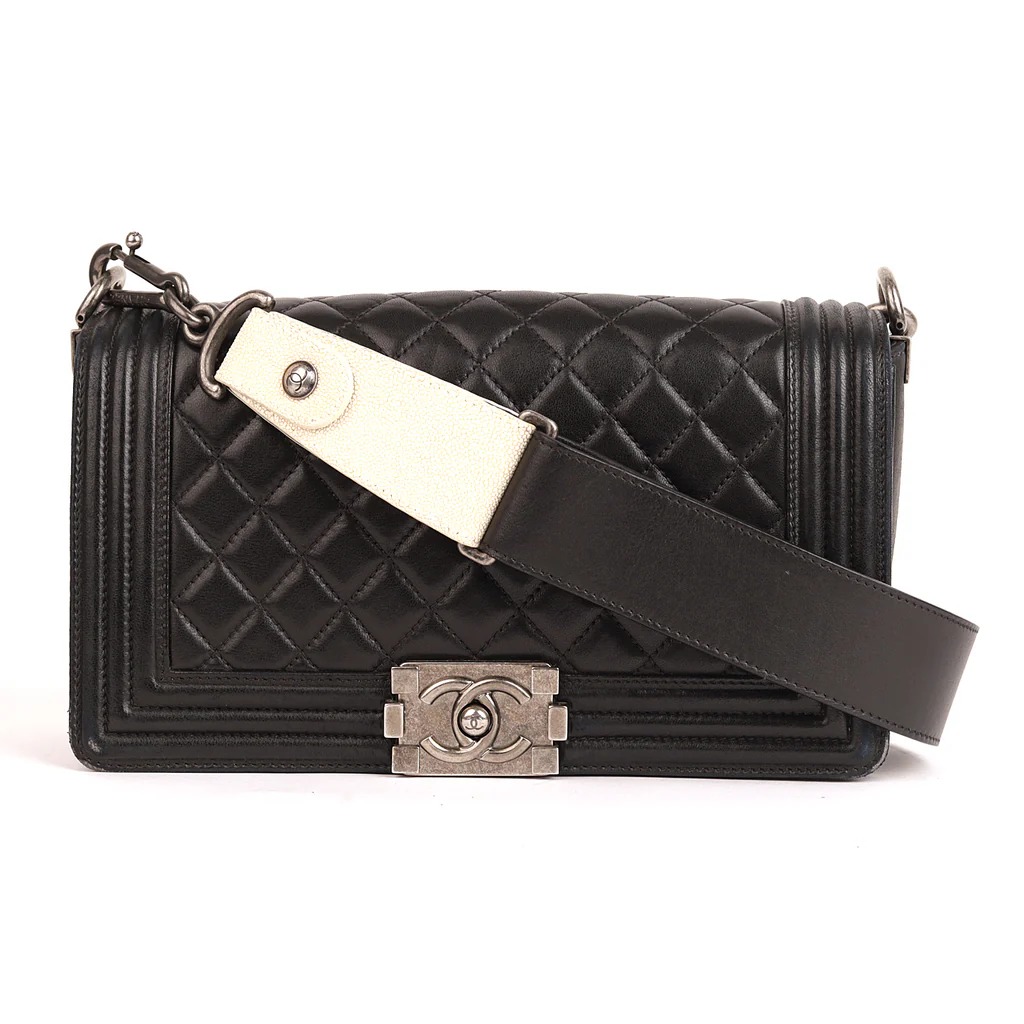 Chanel Boy Bag with a quilted calfskin leather exterior, a ruthenium-finish metal clasp
