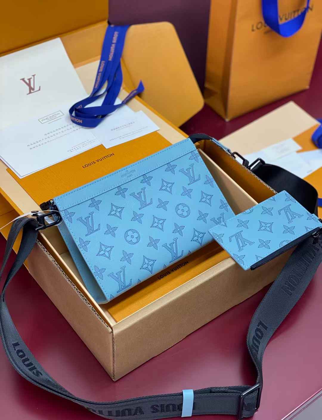 LV Gaston Wearable Wallet in sky blue Taigarama leather