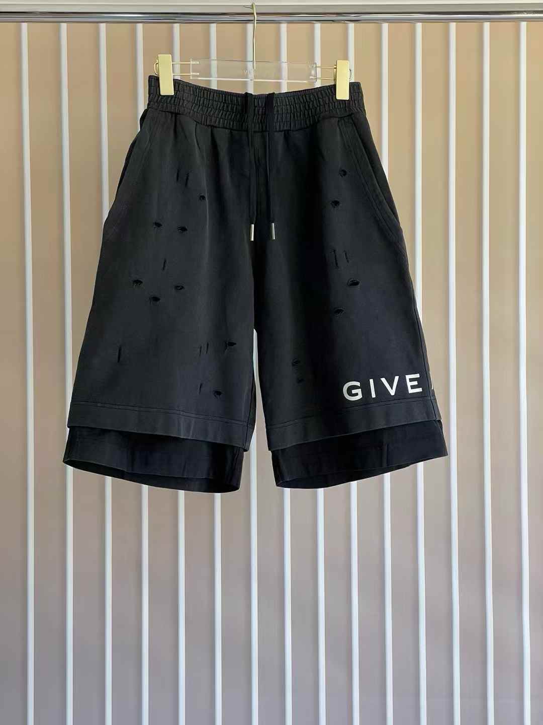 Givenchy Archetype Destroyed Shorts in black cotton