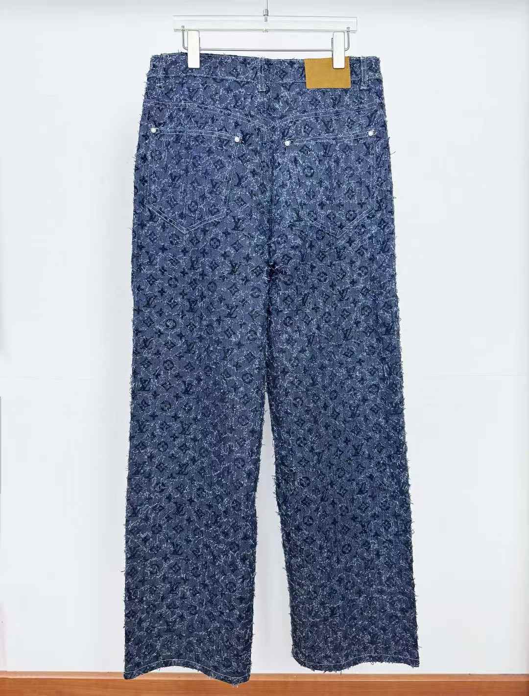 lv denim pants with a monogram pattern