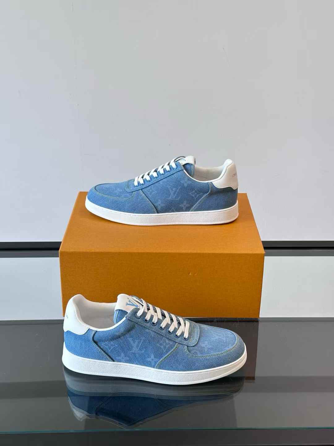 LV Rivoli Sneaker in a blue denim-like material with a white sole
