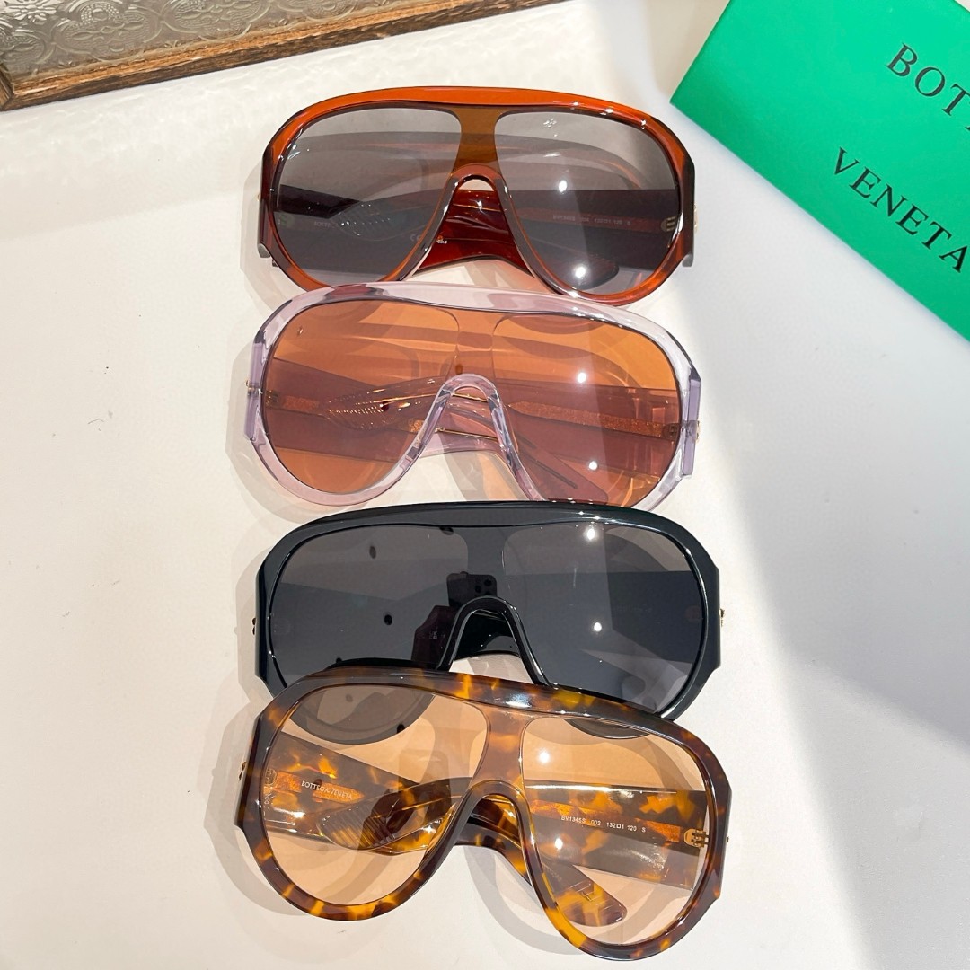 Bottega Veneta BV1345S oversized mask sunglasses in a tortoiseshell frame with light yellow lenses.