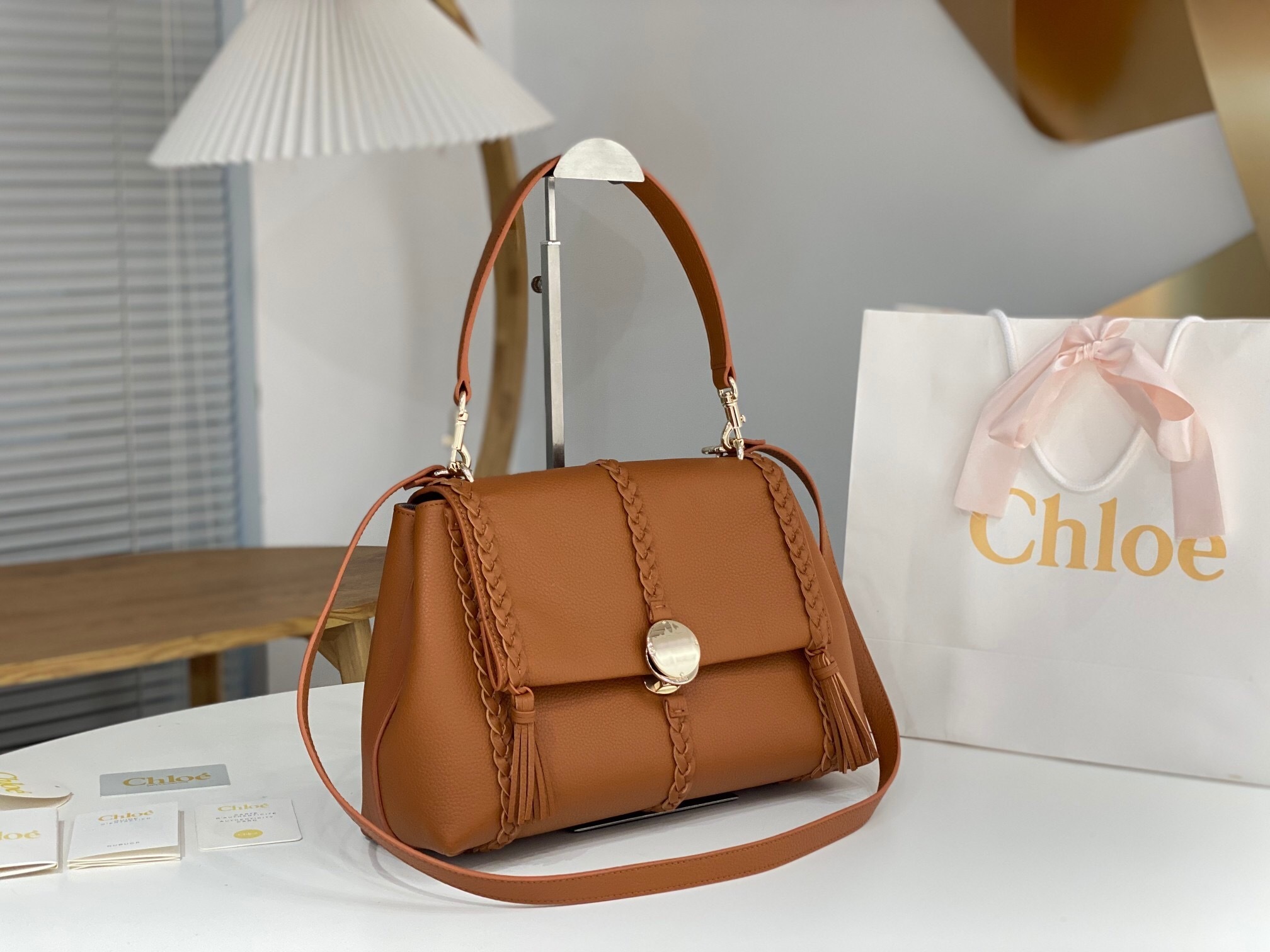 Chloé Penelope Medium shoulder bag in brown calf leather with braided details and a gold-tone clasp