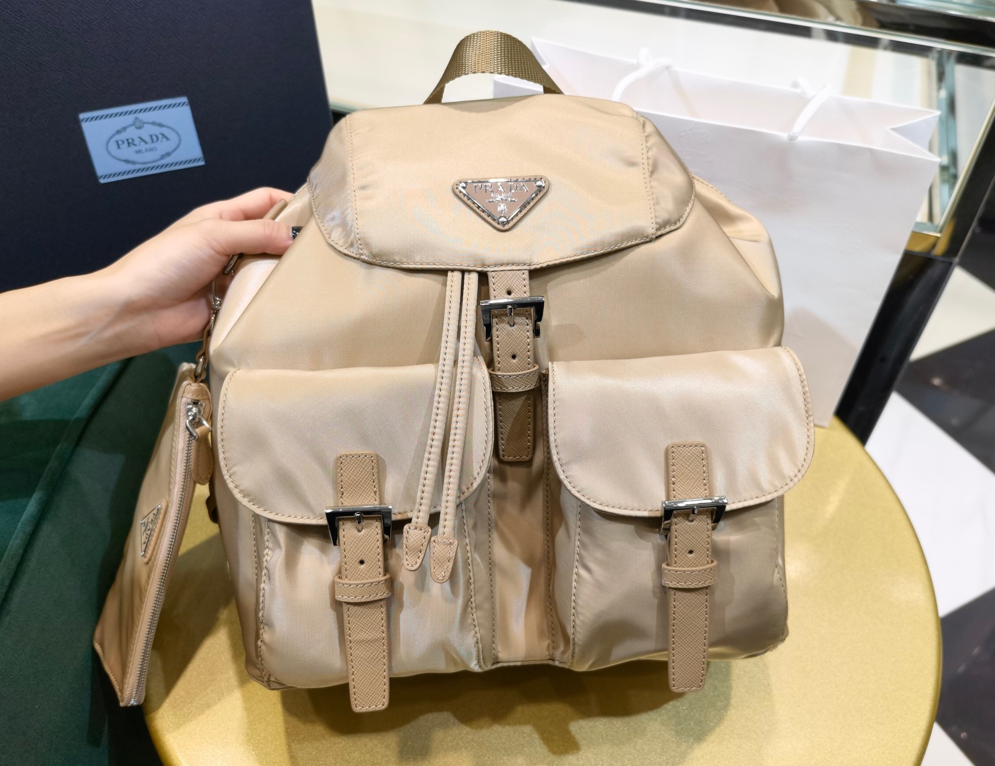 Prada Re-Nylon backpack, featuring Saffiano leather detachable pouch