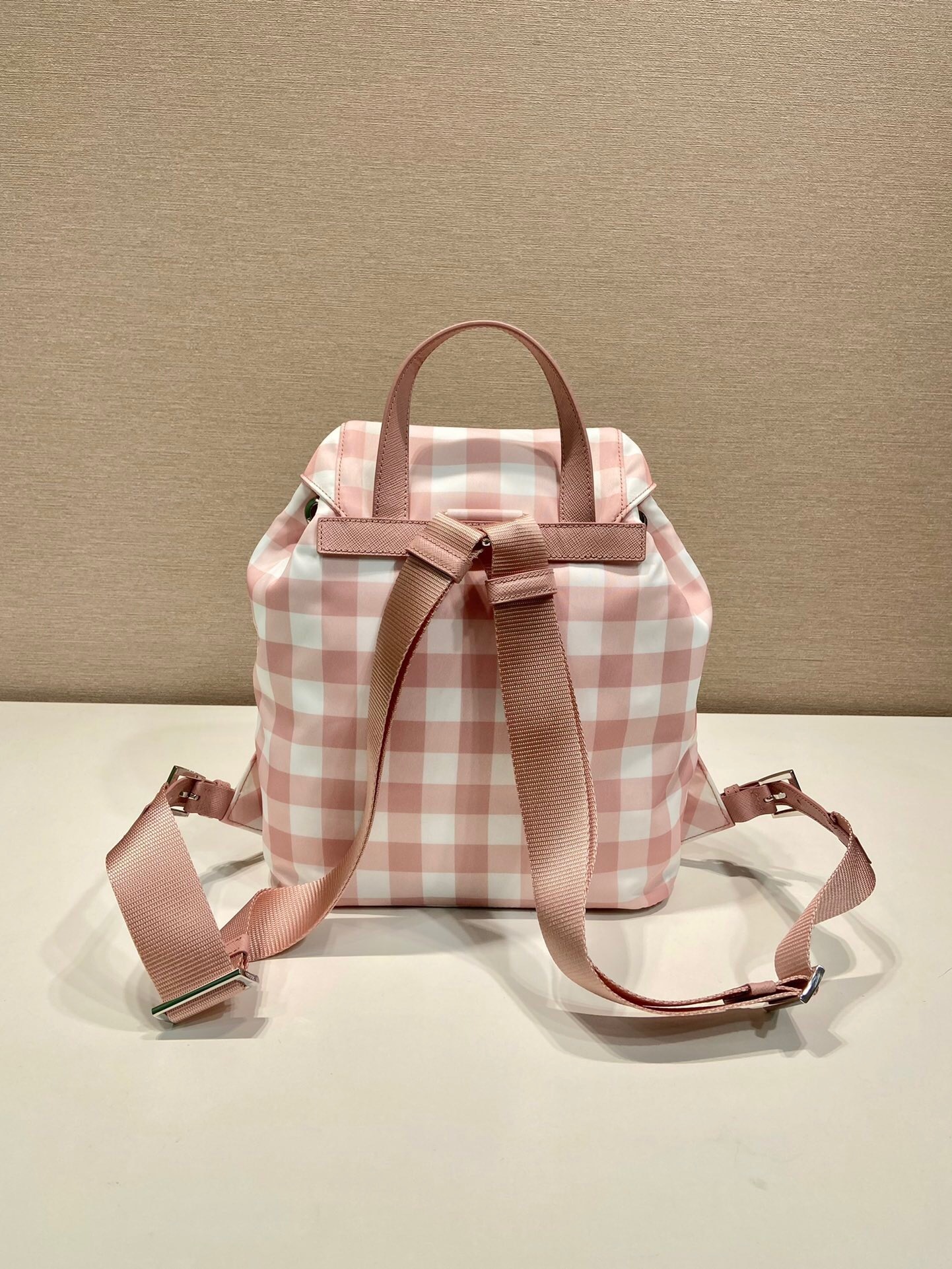 Prada small Re-Nylon backpack in a pink and white gingham print