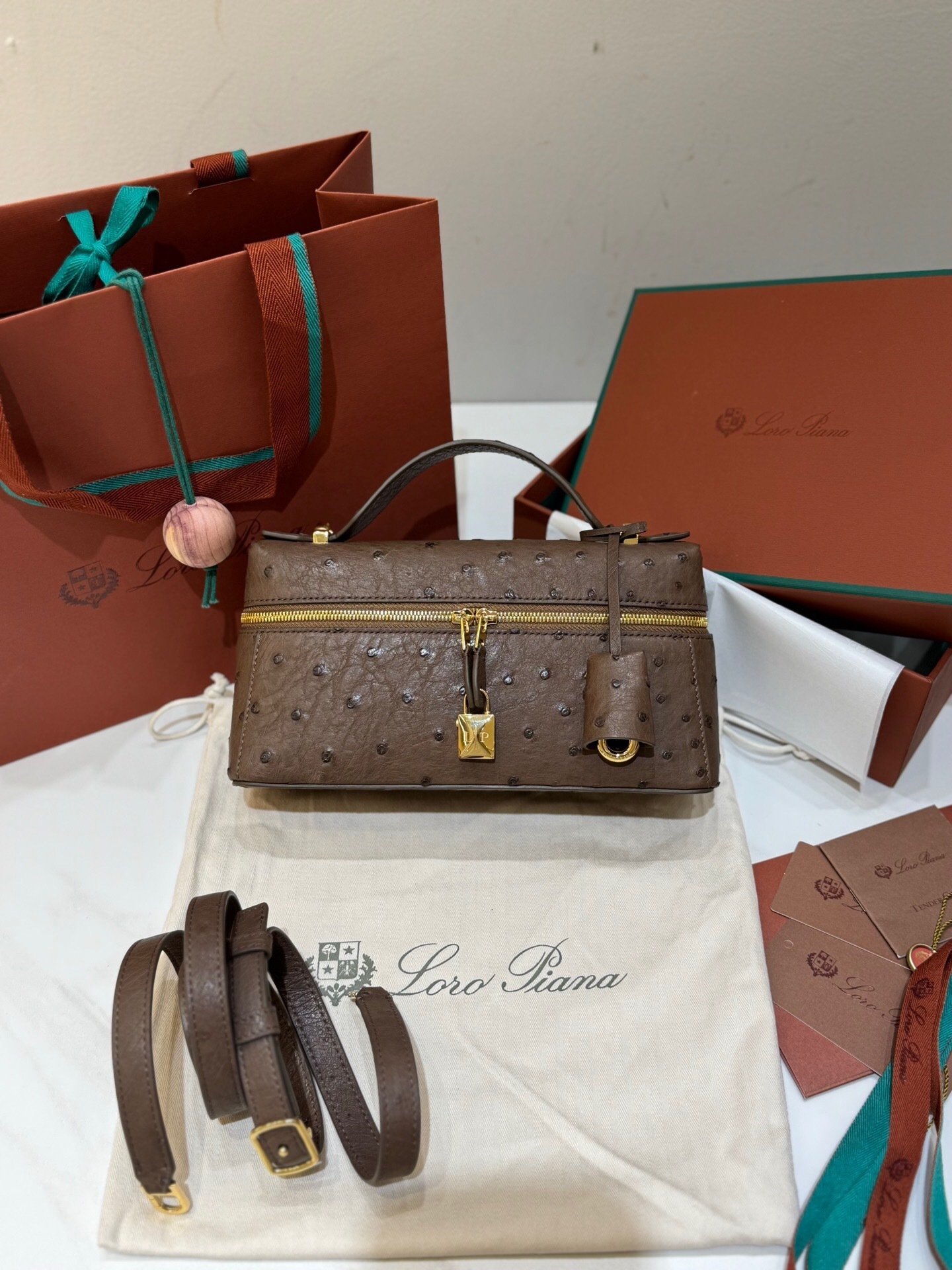 Loro Piana Extra Bag Vanity Case L27 in ostrich leather and a cognac/burnt tan color