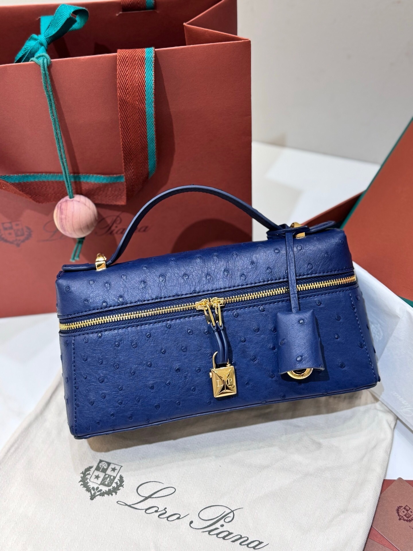 Loro Piana Extra Bag Vanity Case L27 in blue ostrich leather with gold-tone hardware