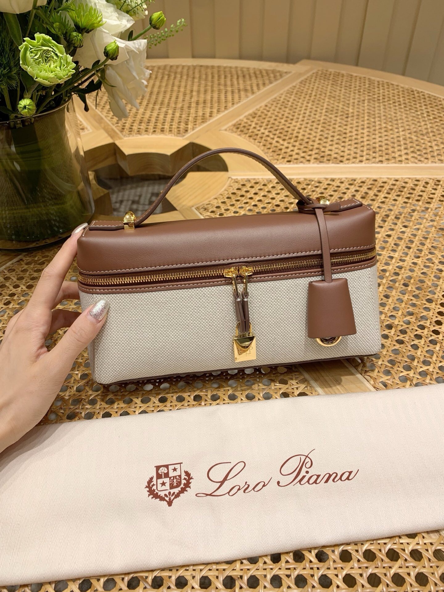 Loro Piana Extra Bag Vanity Case L23 in a two-tone design, possibly featuring calfskin leather with a linen-like finish