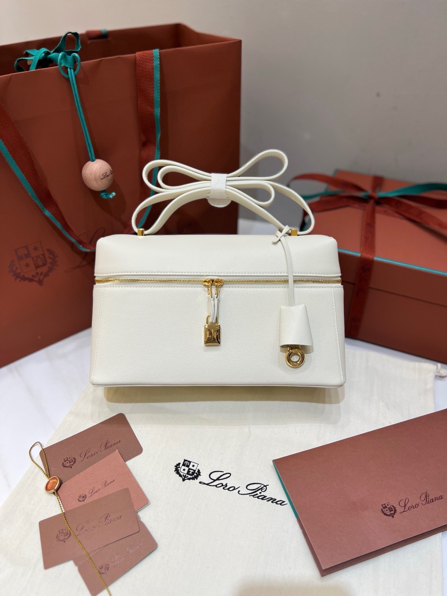 Loro Piana Extra Bag Vanity case L27 in smooth calfskin leather, potentially in the "Sunday Morning" white color