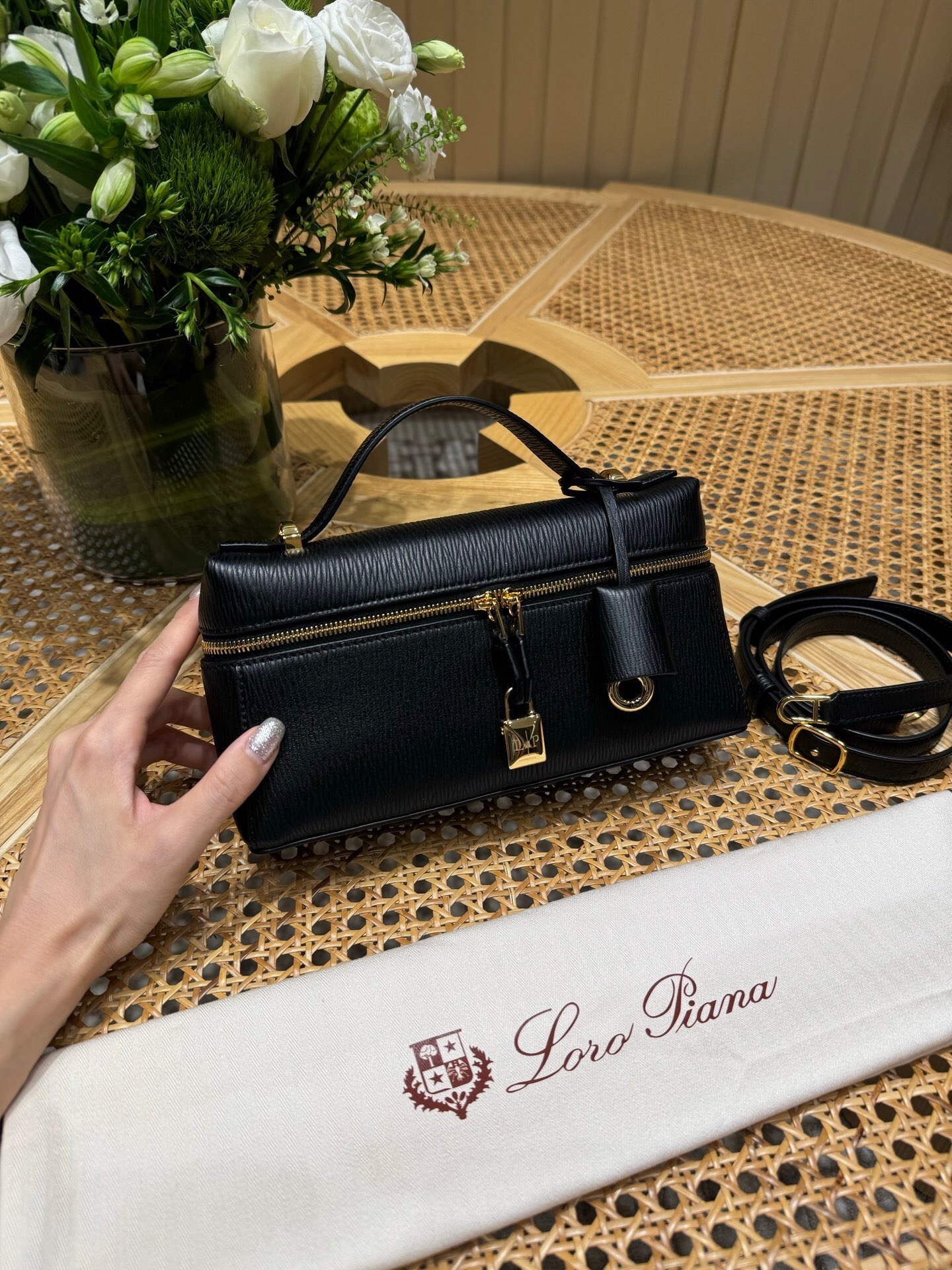 Loro Piana Extra Bag Vanity Case L23 in black calfskin with a double-zip closure and a 3D lock charm.