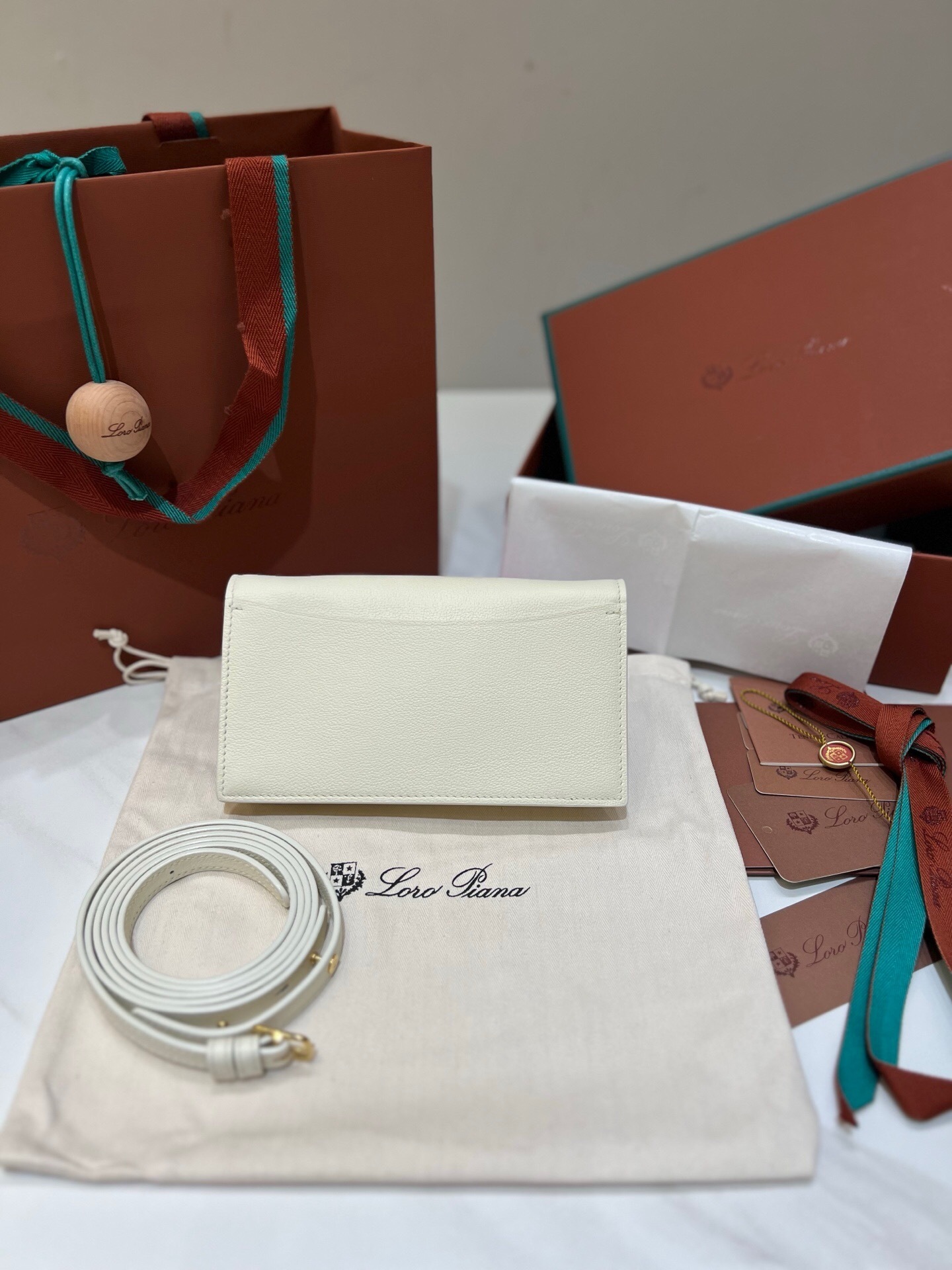 Loro Piana Extra Pochette in Whisper White calfskin leather