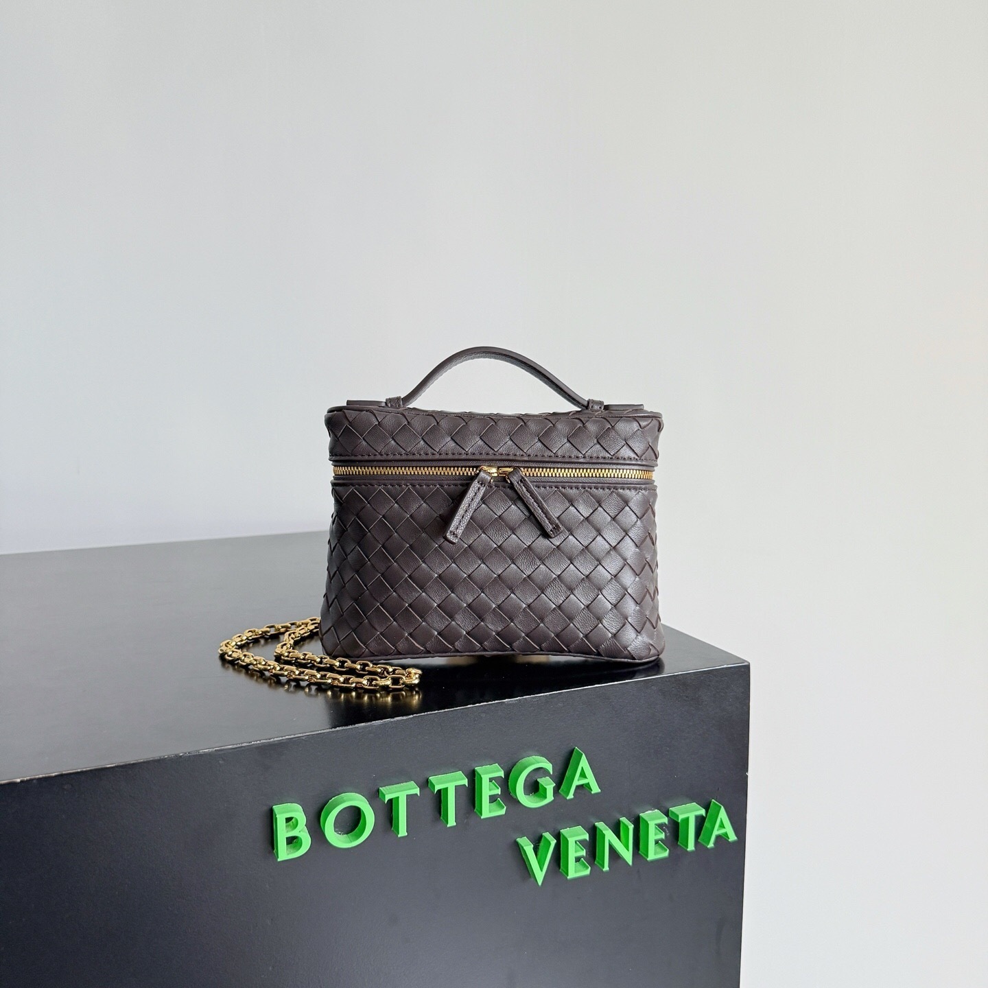Bottega Veneta Intrecciato leather small vanity case or shoulder bag in a dark brown color