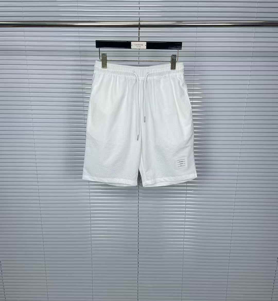 Thom Browne white ripstop swim short with a striped grosgrain loop tab at the back
